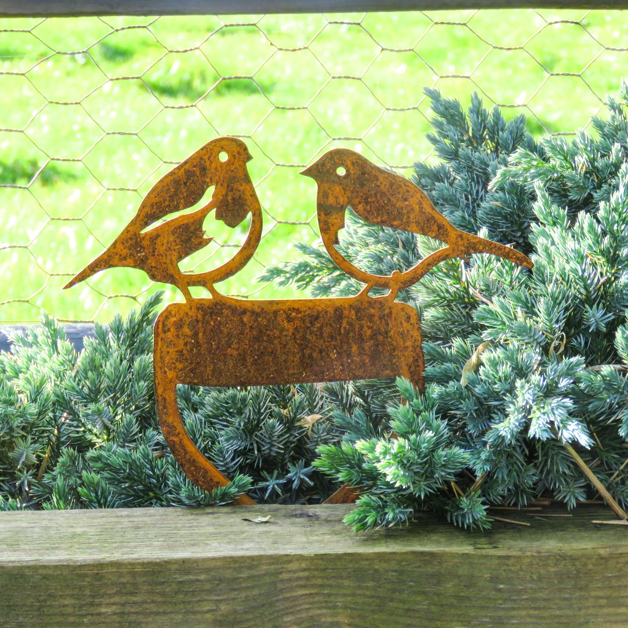 Robins on a spade garden ornament