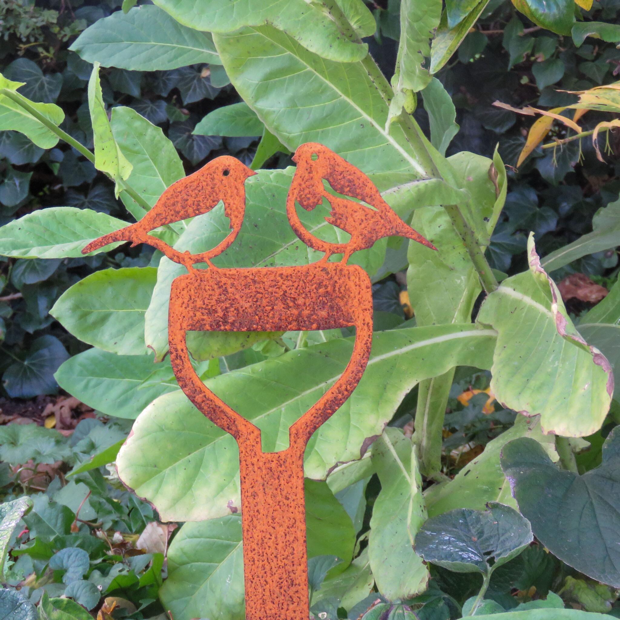 Rusty metal robins on a spade