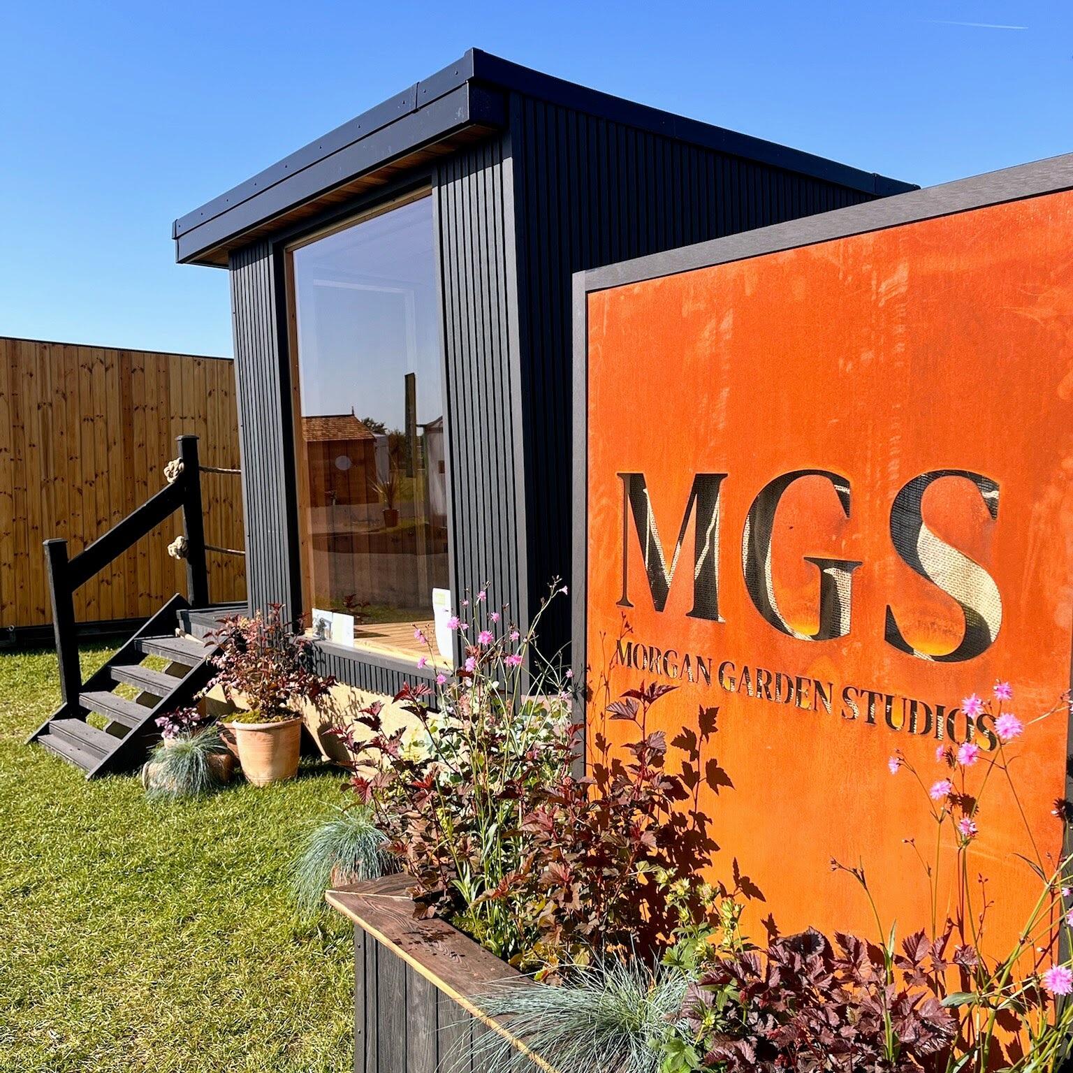 Corten steel business logo sign in the clients custom font