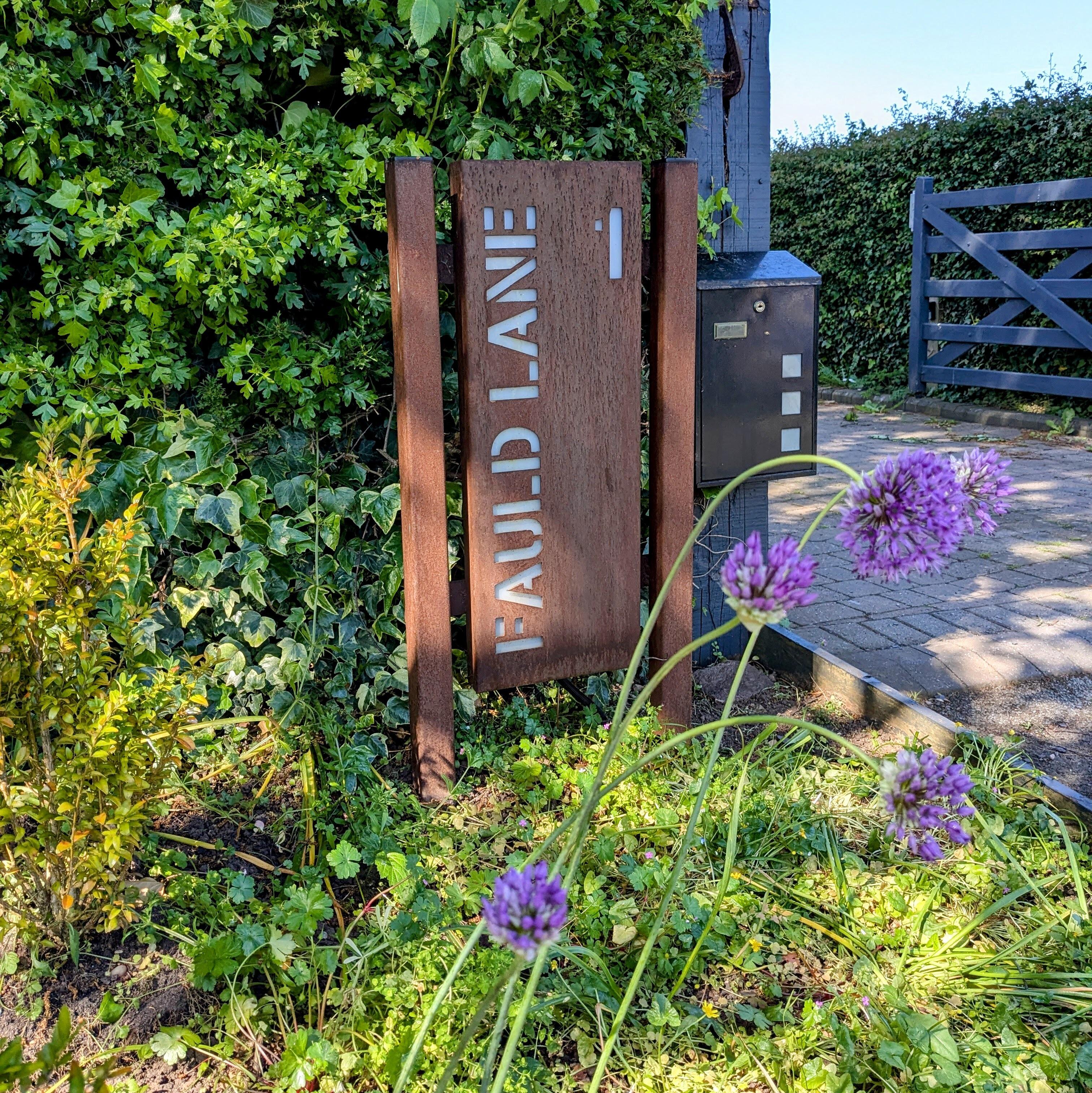 Back lit Corten steel sign on posts