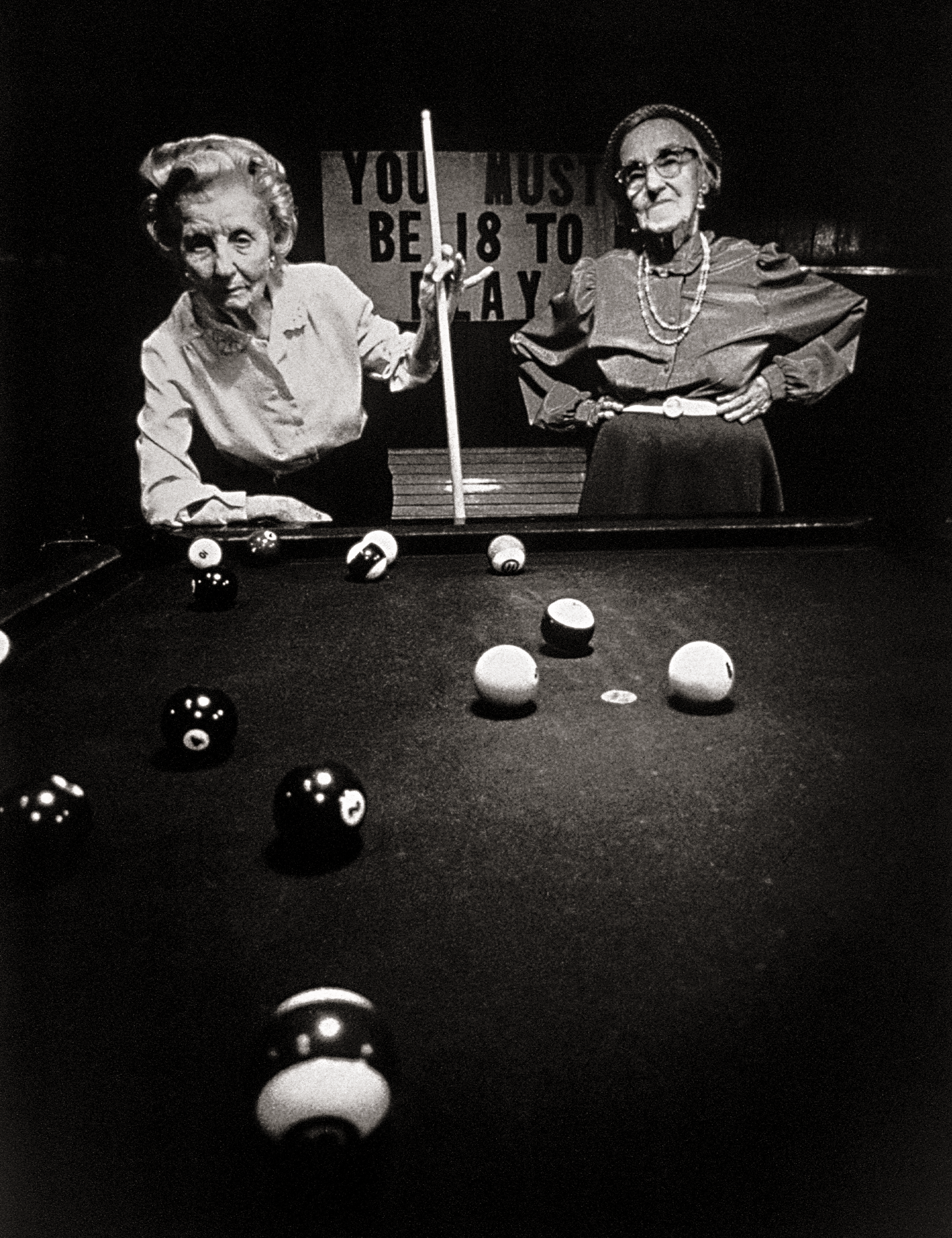 Old ladies playing pool