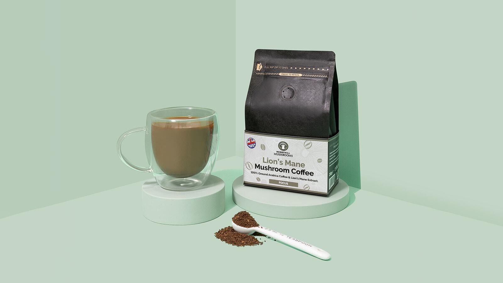 Lion's Mane mushroom coffee in a mug next to a ground coffee pack