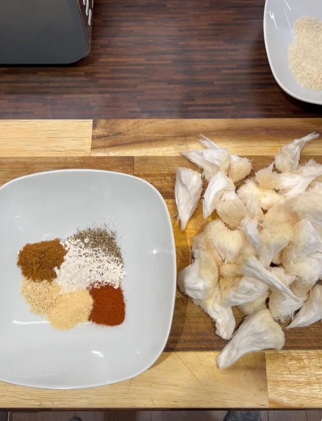 Torn Lion's Mane pieces prepared and ready for pan frying