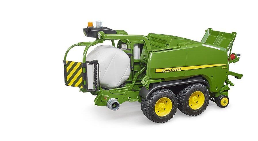 John Deere wrapping chamber baler toy ejecting a wrapped bale