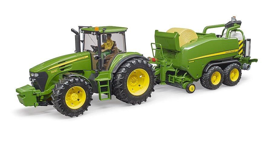 John Deere tractor towing the C441R wrapping chamber baler toy in a farm scene