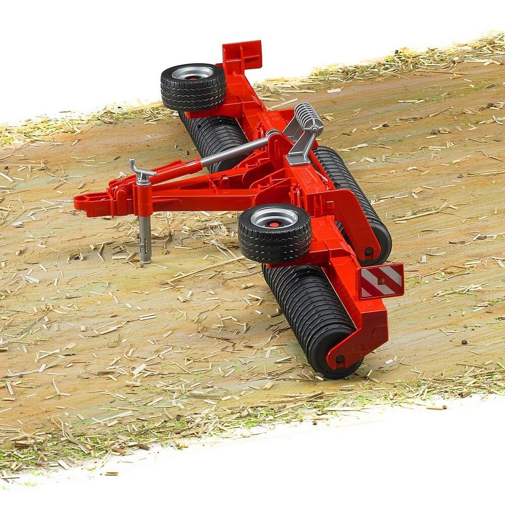 Bruder Cambridge Roller toy being used on a farm-style play surface