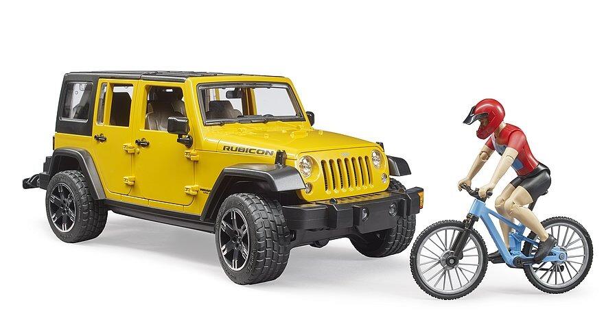 Side view of Bruder Jeep Wrangler Rubicon in yellow with cyclist and mountain bike