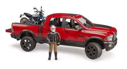 Bruder RAM 2500 Power Wagon 1:16 scale pickup with Ducati Desert Sled motorcycle loaded on the truck bed and rider figure standing beside