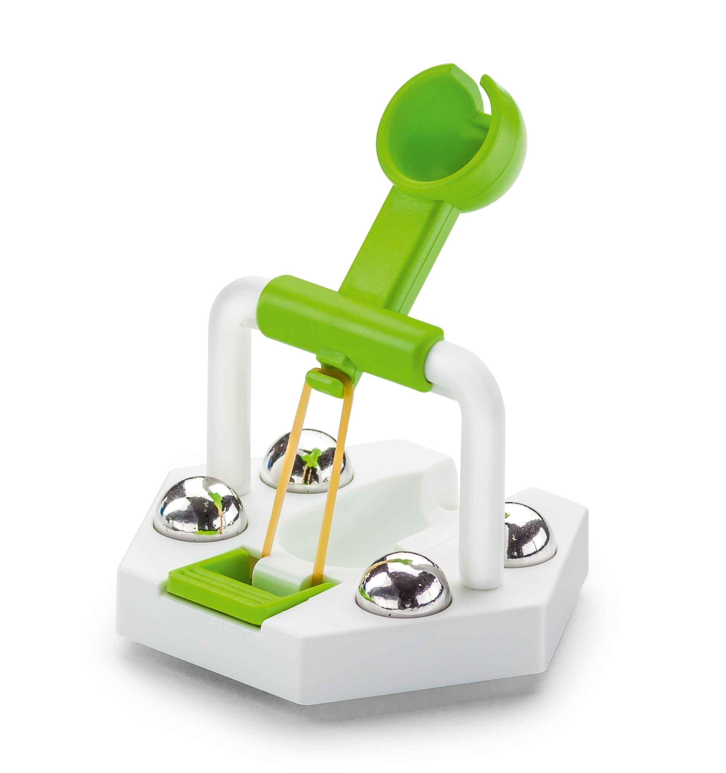 Close-up of the GraviTrax catapult launcher showing the spring-loaded mechanism and marble holders