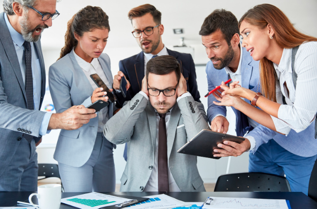 Man overwhelmed at work