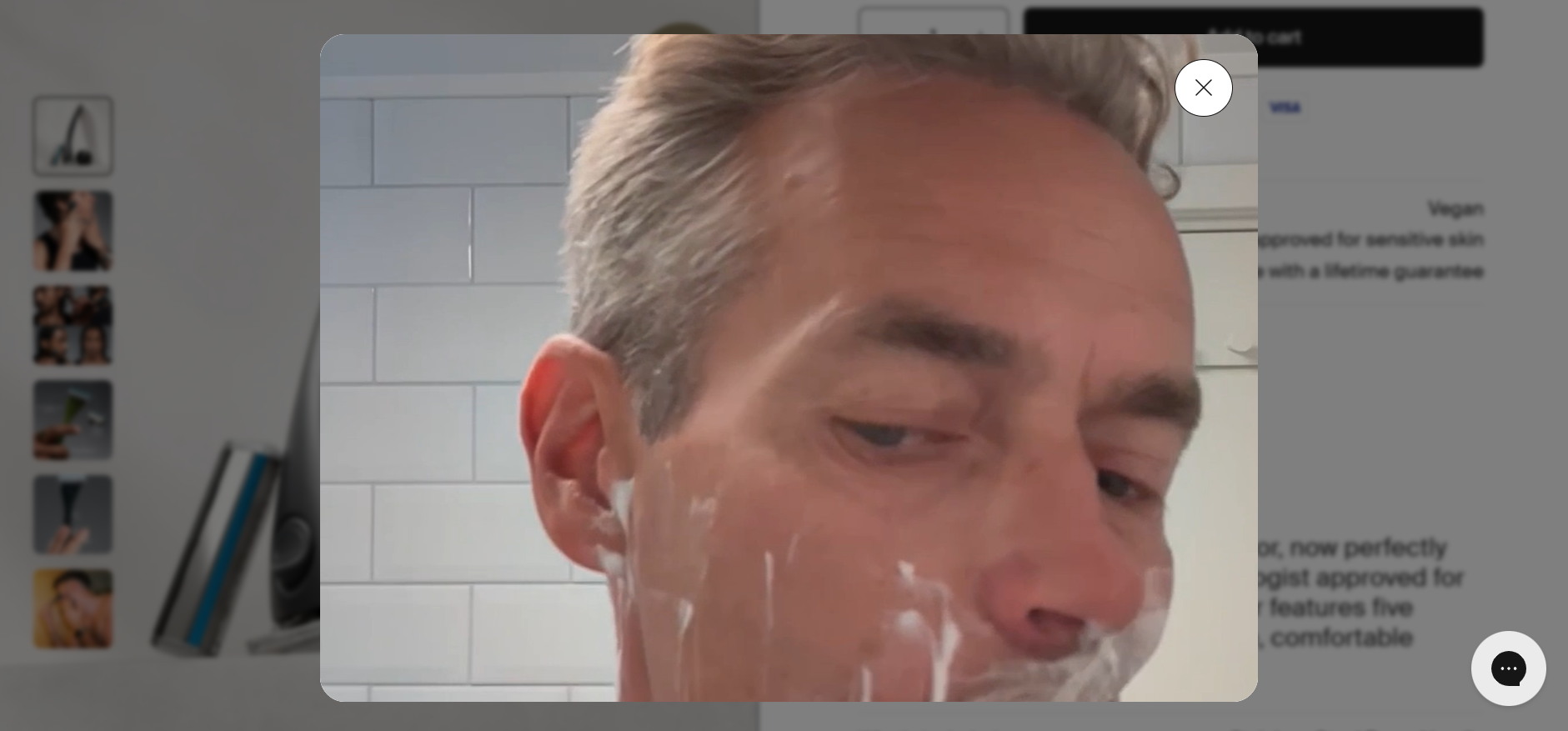 "Screenshot showing a pop-up video of a man shaving with an Estrid razor, demonstrating the product in real use as part of the site’s 'See in action' user-generated content feature."