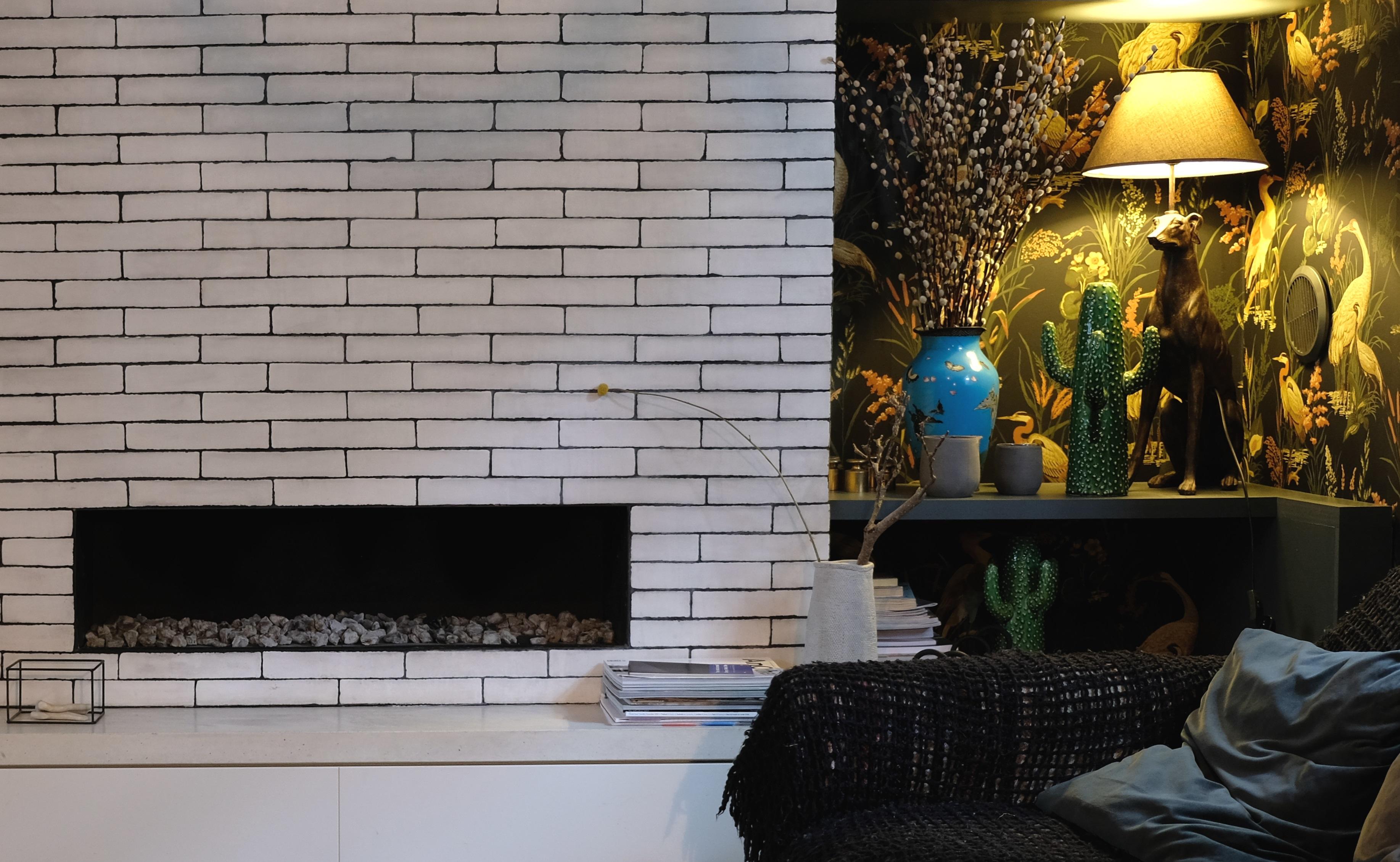 Stunning dark and moody snug with brick fireplace in De Beauvoir Townhouse for Living Etc.