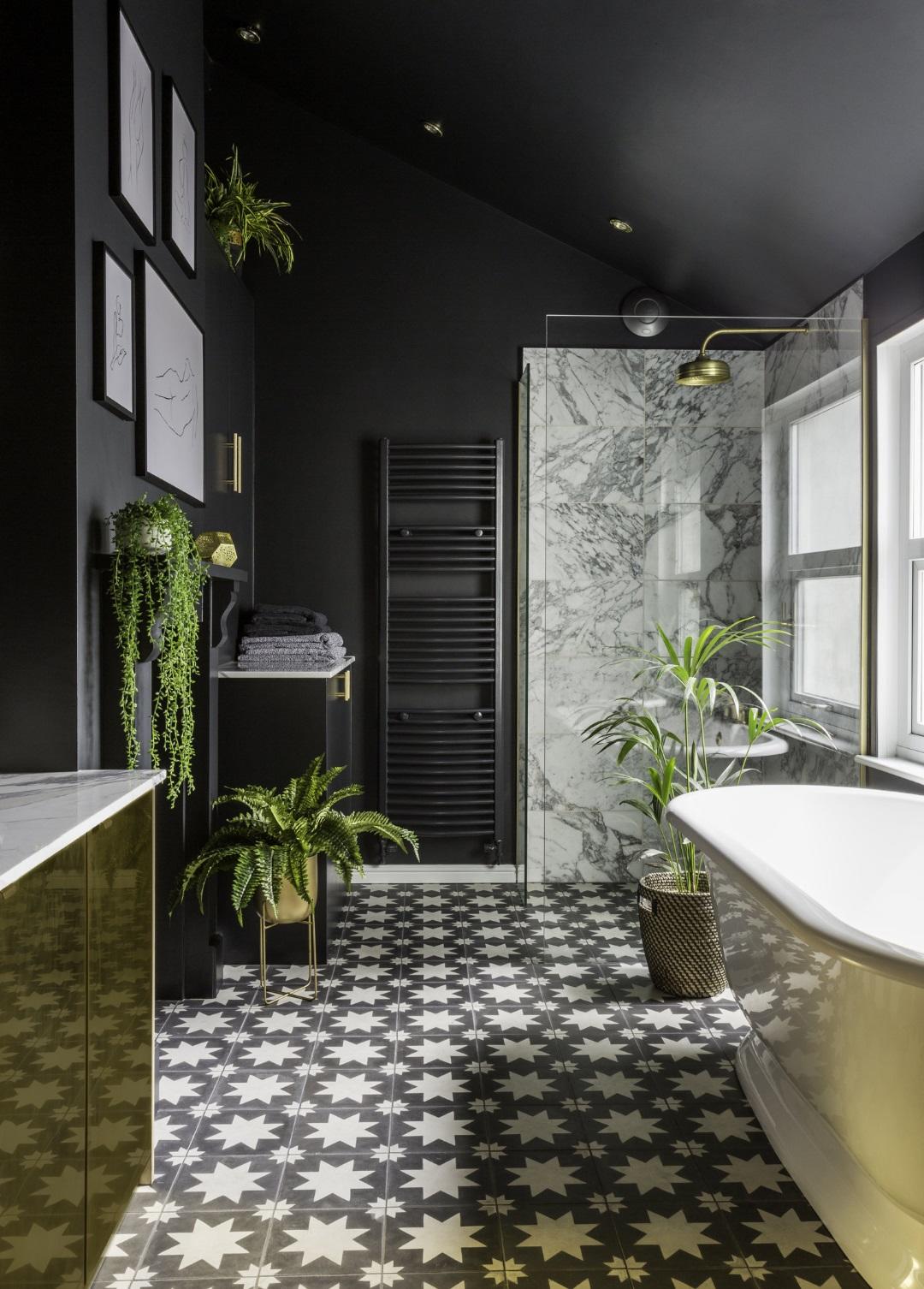 Stunning dark bathroom with metallic details by Gold Is A Neutral