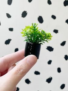 mini faux plant in black pot