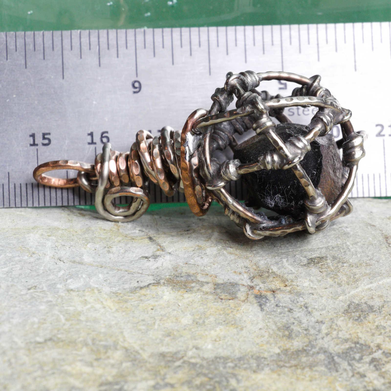 Caged Copper Slag with ruler to show scale