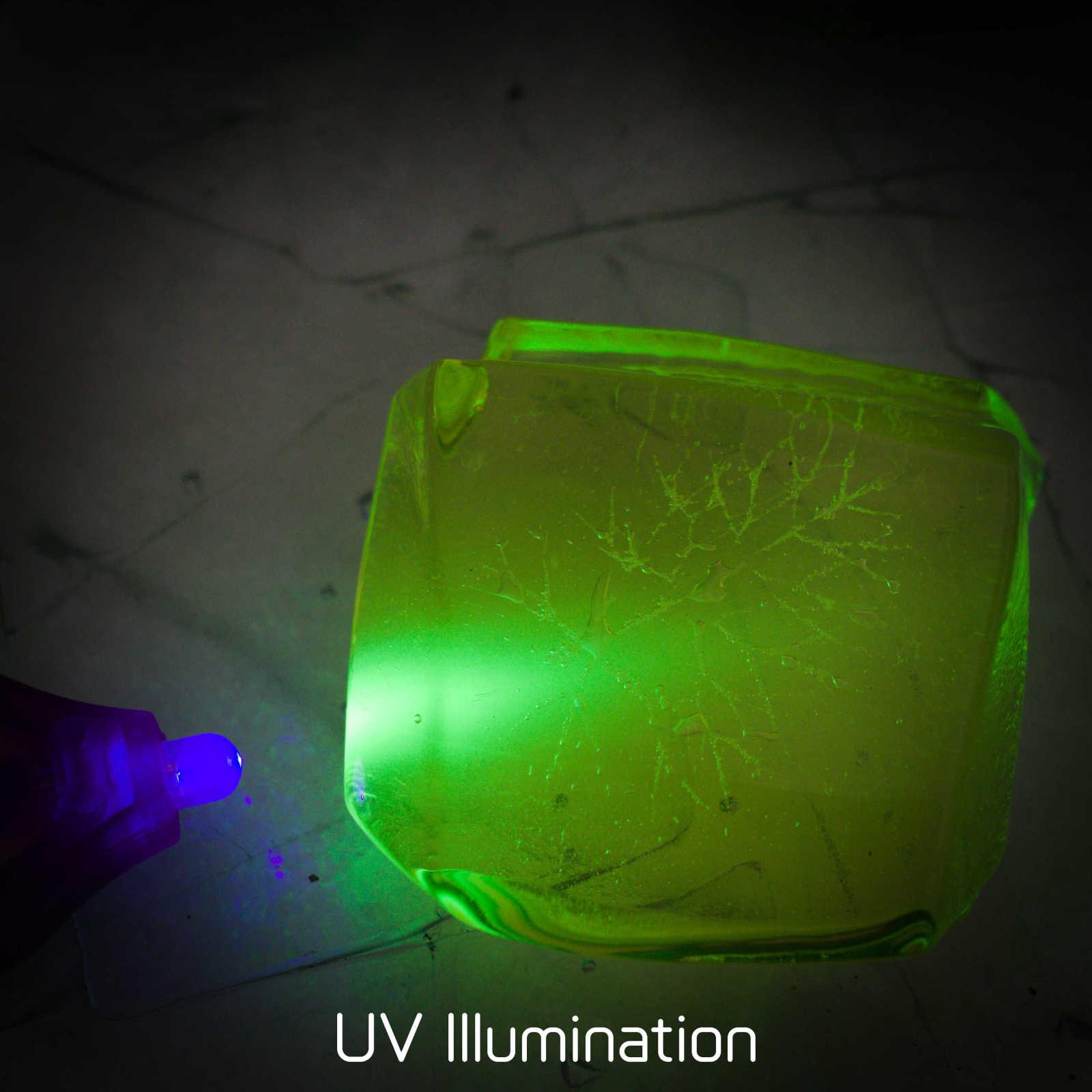 Uranium Glass with fennel leaf impression under UV light