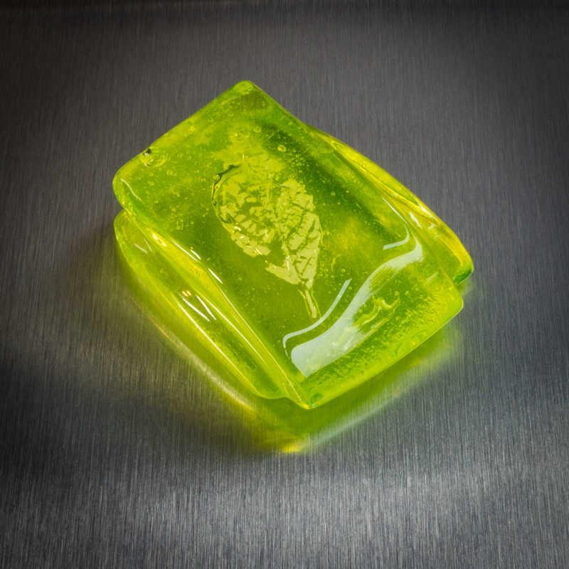 A Uranium Glass ornament or paperweight shown in daylight.