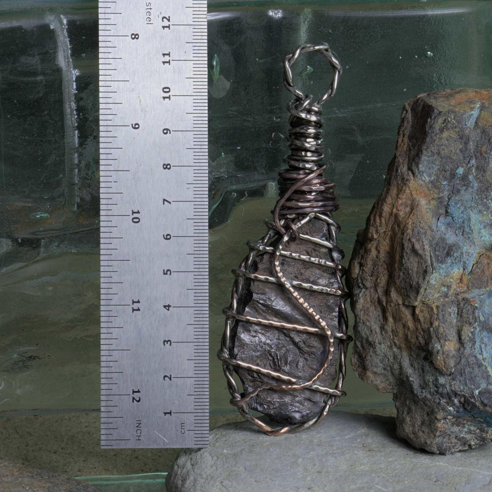 Copper slag accessory with ruler to show scale