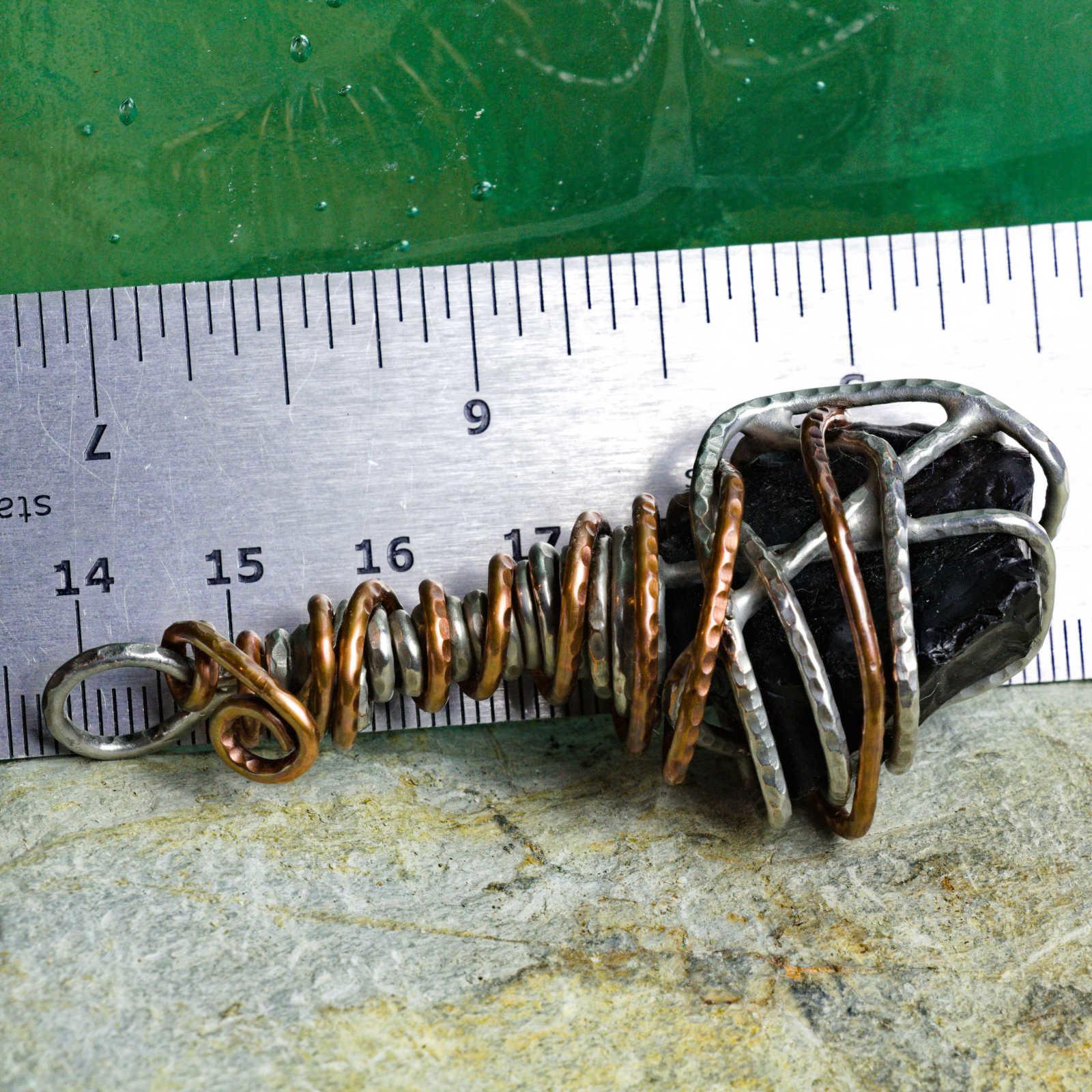 Copper slag accessory, with ruler to show scale