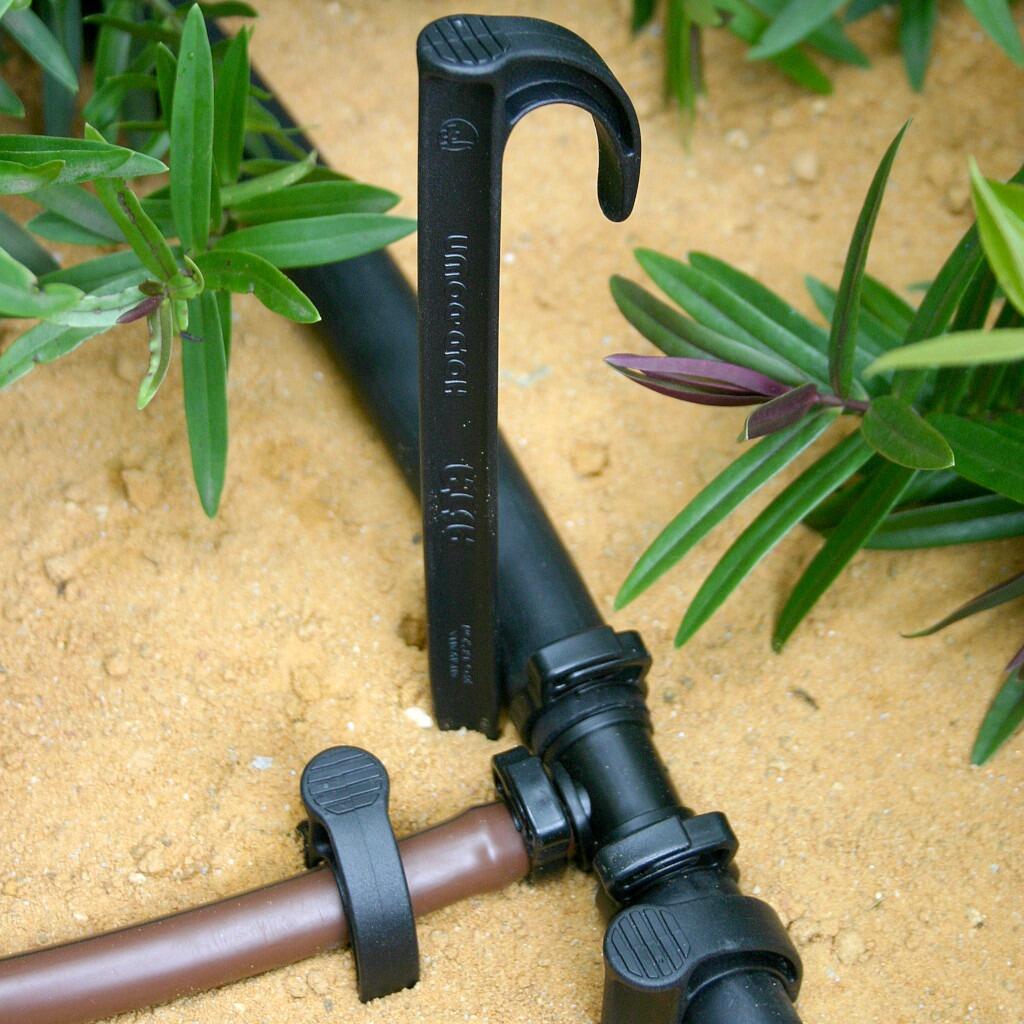 Antelco Irrigation Hold Down Stake holding pipe in Place