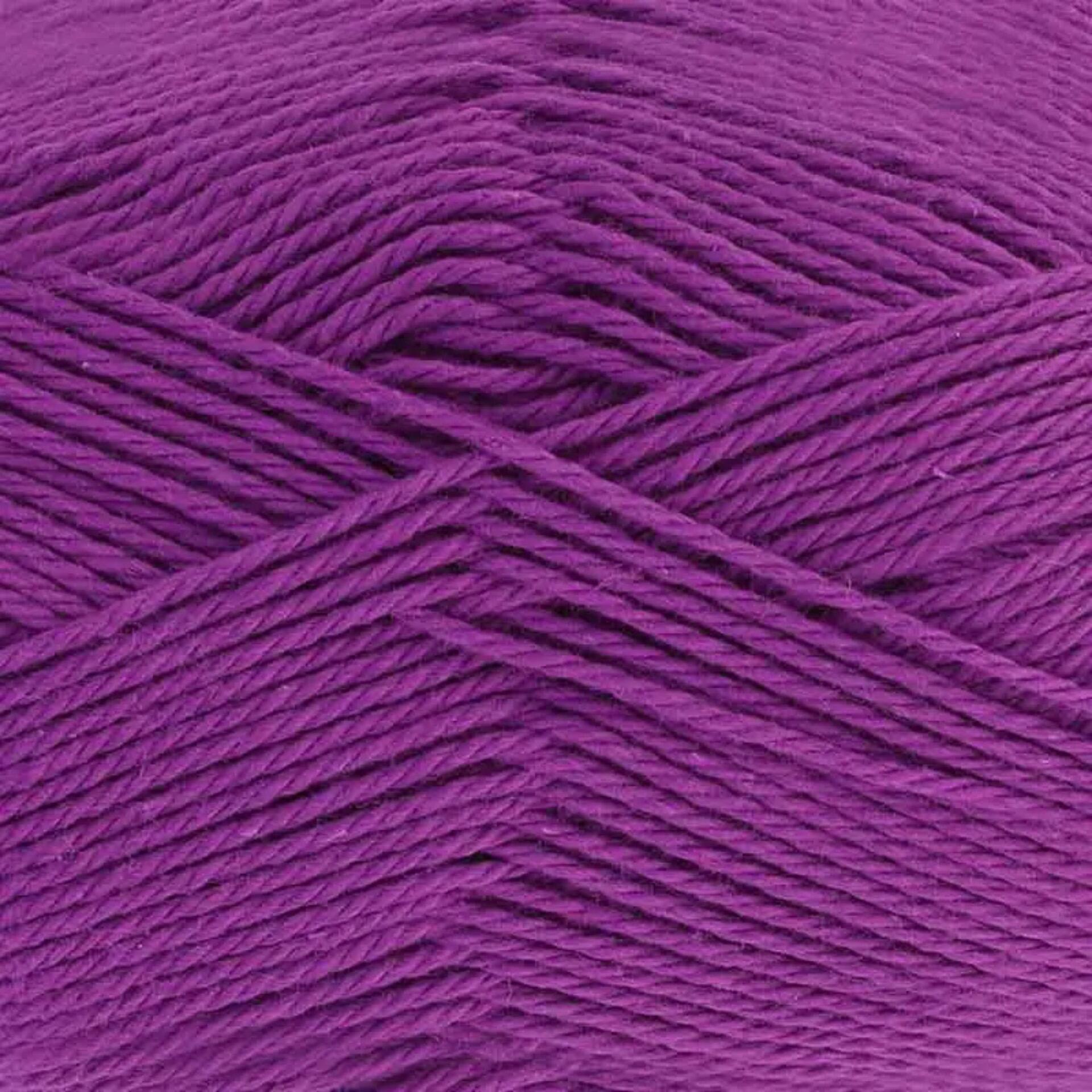 Close-up of King Cole Cottonsoft yarn in Purple Iris, shade number 5703. The yarn features a rich, vibrant purple color with a soft, smooth texture, perfect for crochet and knitting projects.