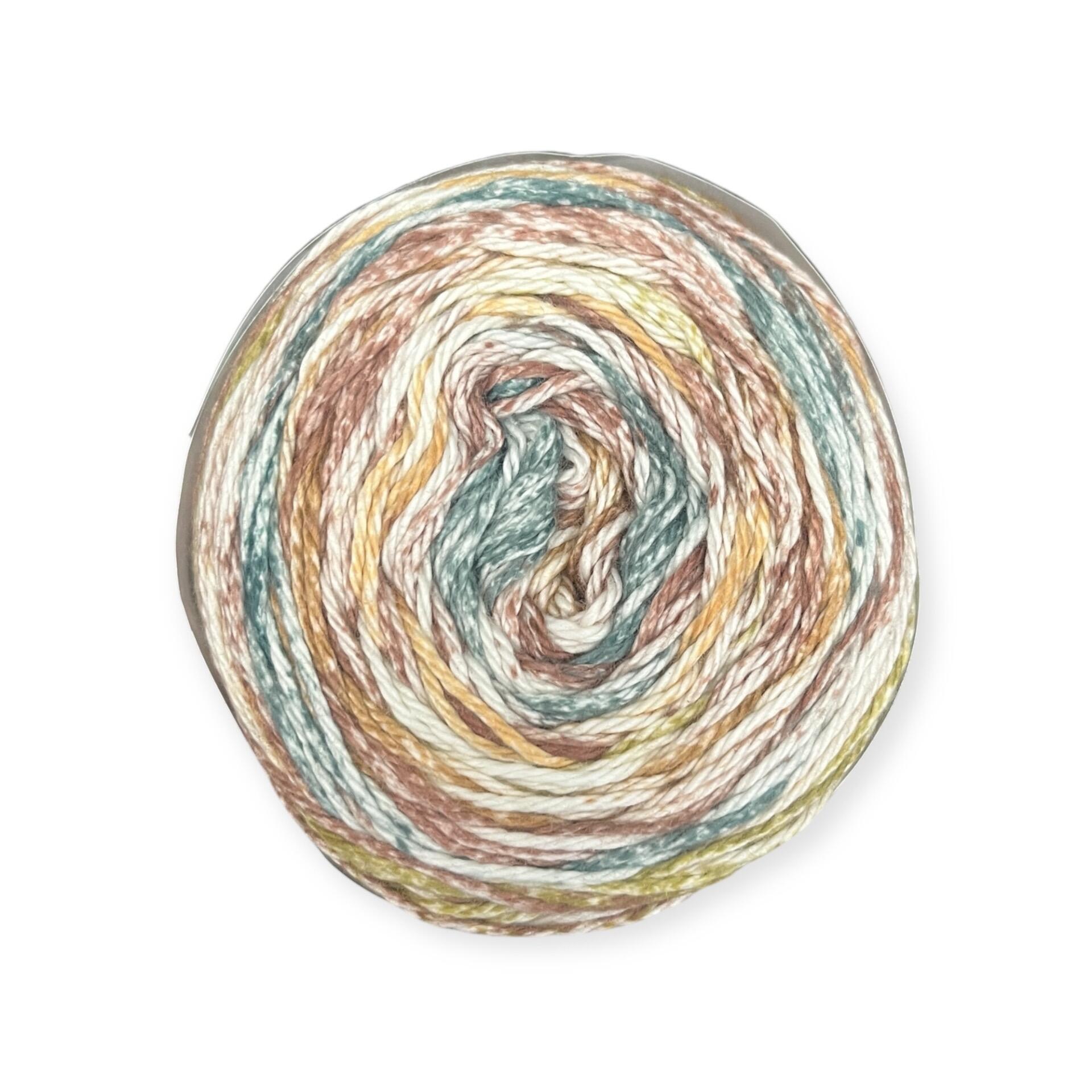 James C. Brett Cotton Waves yarn cake in Camouflage WV07 – 100% cotton DK yarn featuring earthy tones of brown, green, mustard, and white.