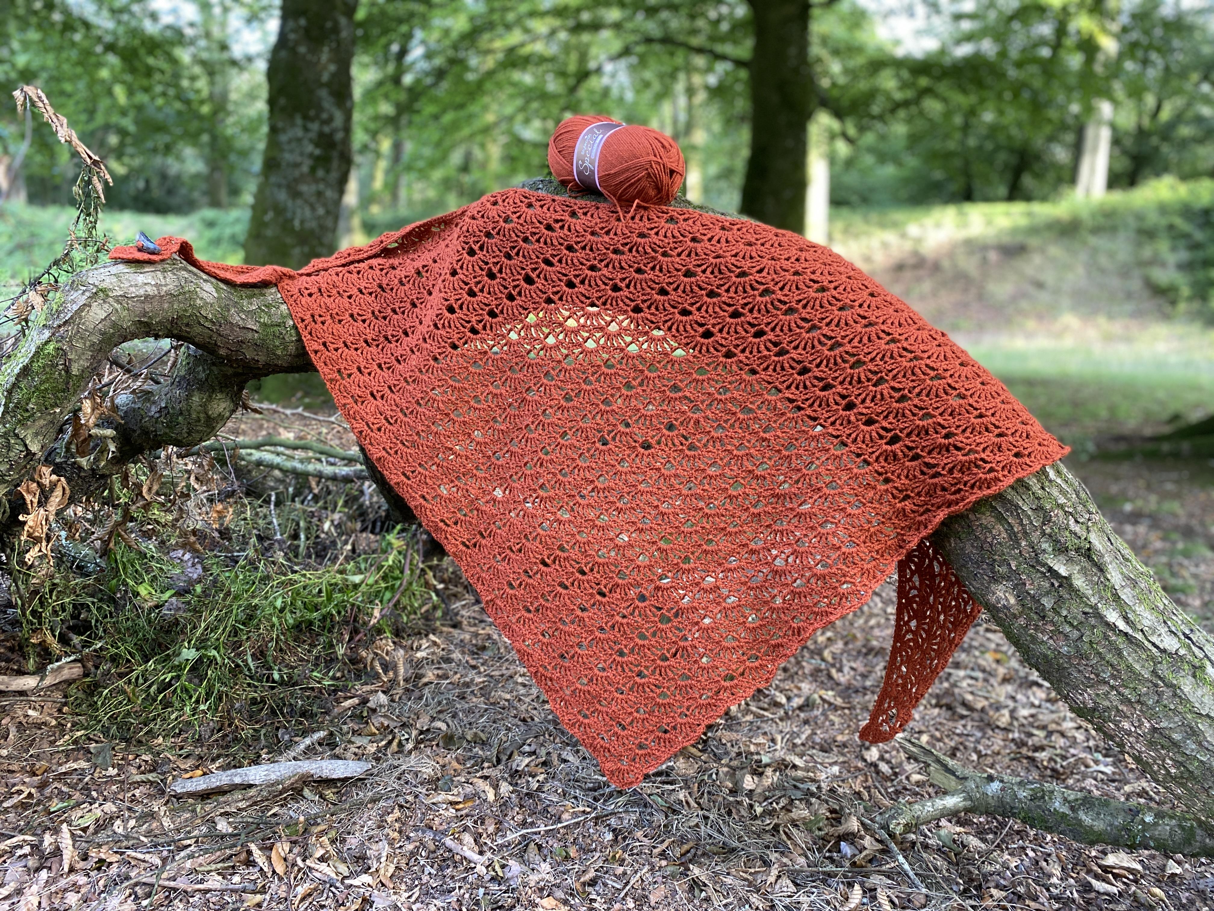 crochet shawl in the woods