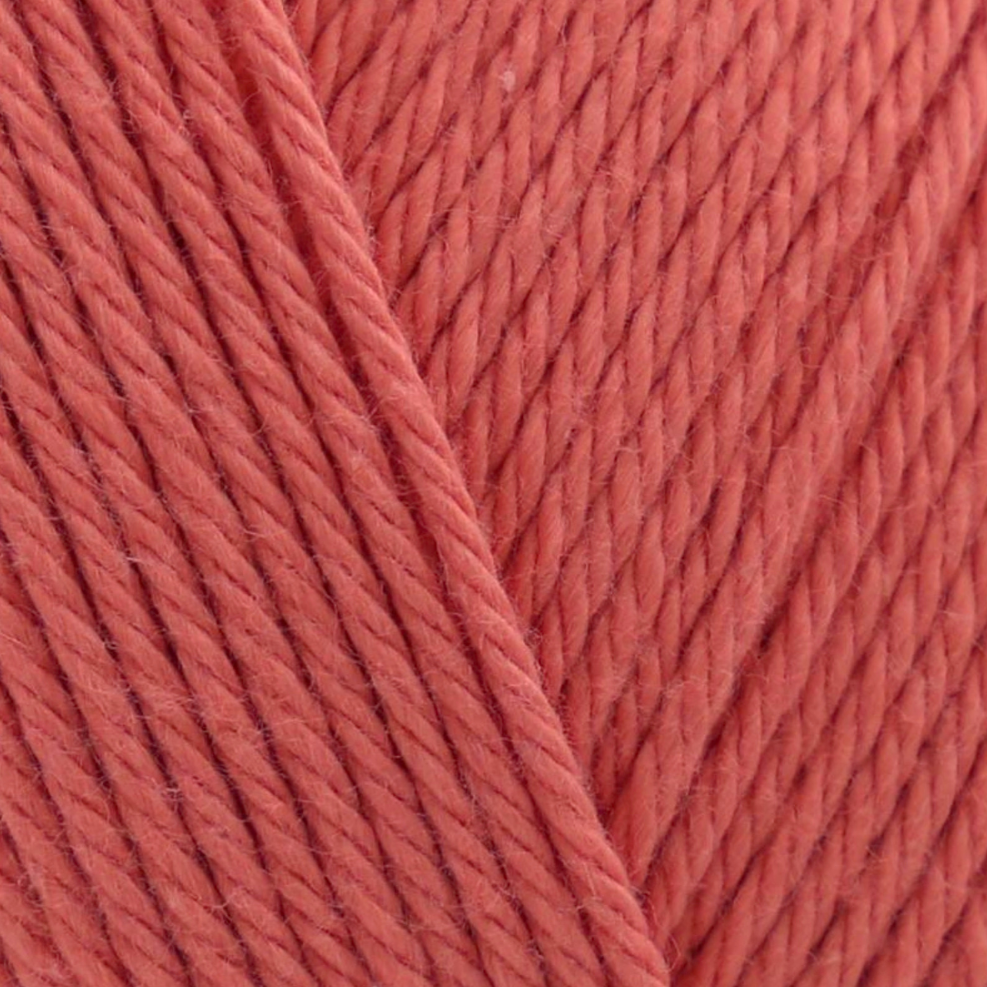 James C. Brett It’s Pure Cotton DK yarn Fire Cracker IC30, 100% cotton DK yarn texture in a bright coral red shade.
