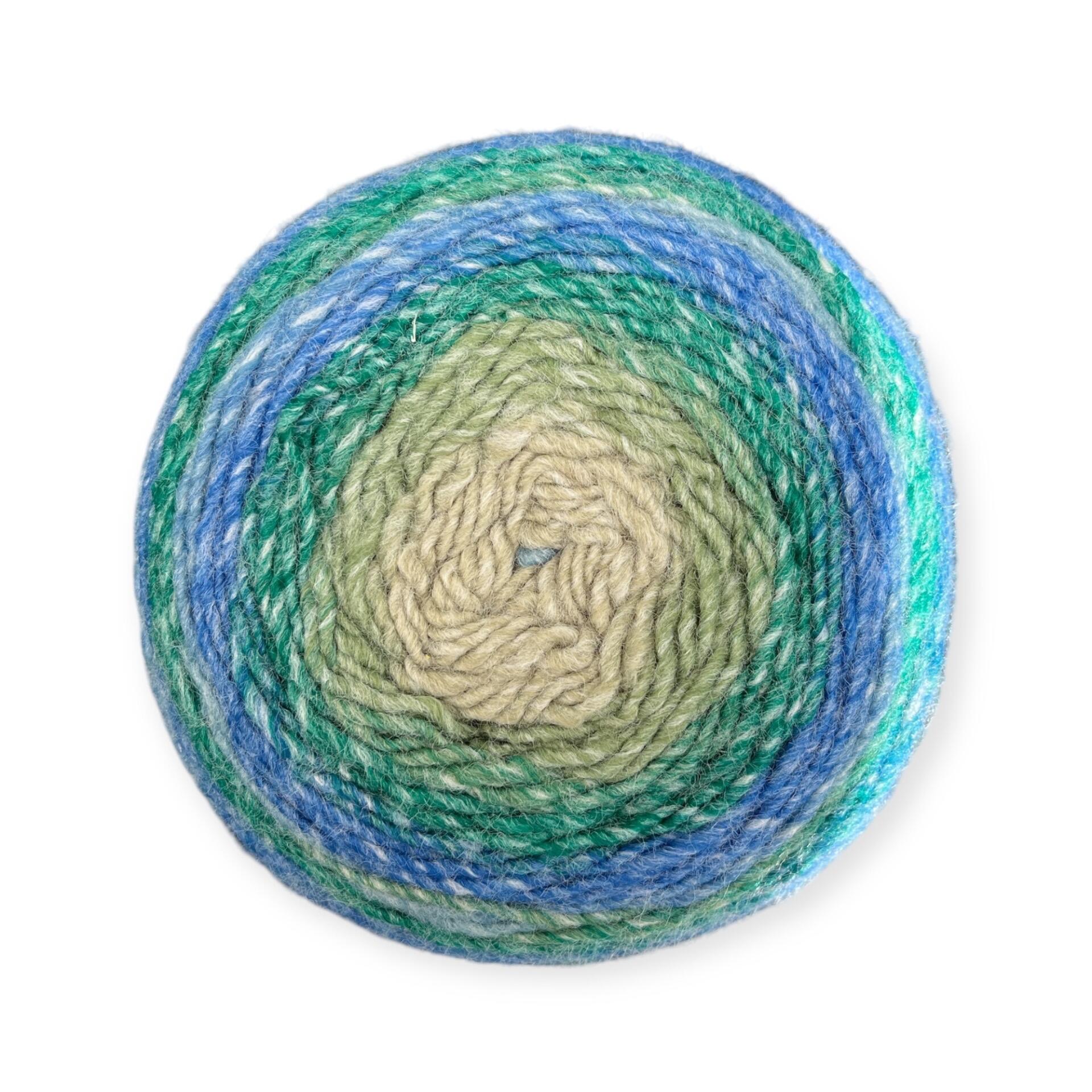 Gradient yarn cake of King Cole Curiosity DK in Forest (2908), featuring earthy shades of green, teal, and blue—perfect for nature-themed knitting and crochet creations.
