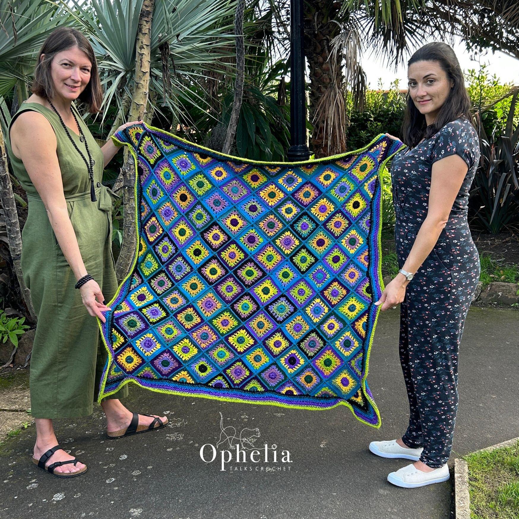 Anja and Emma holding the peacock blanket