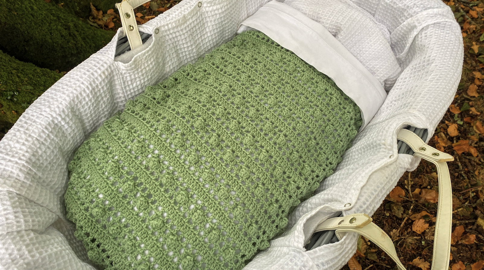 crochet baby blanket in Moses basket