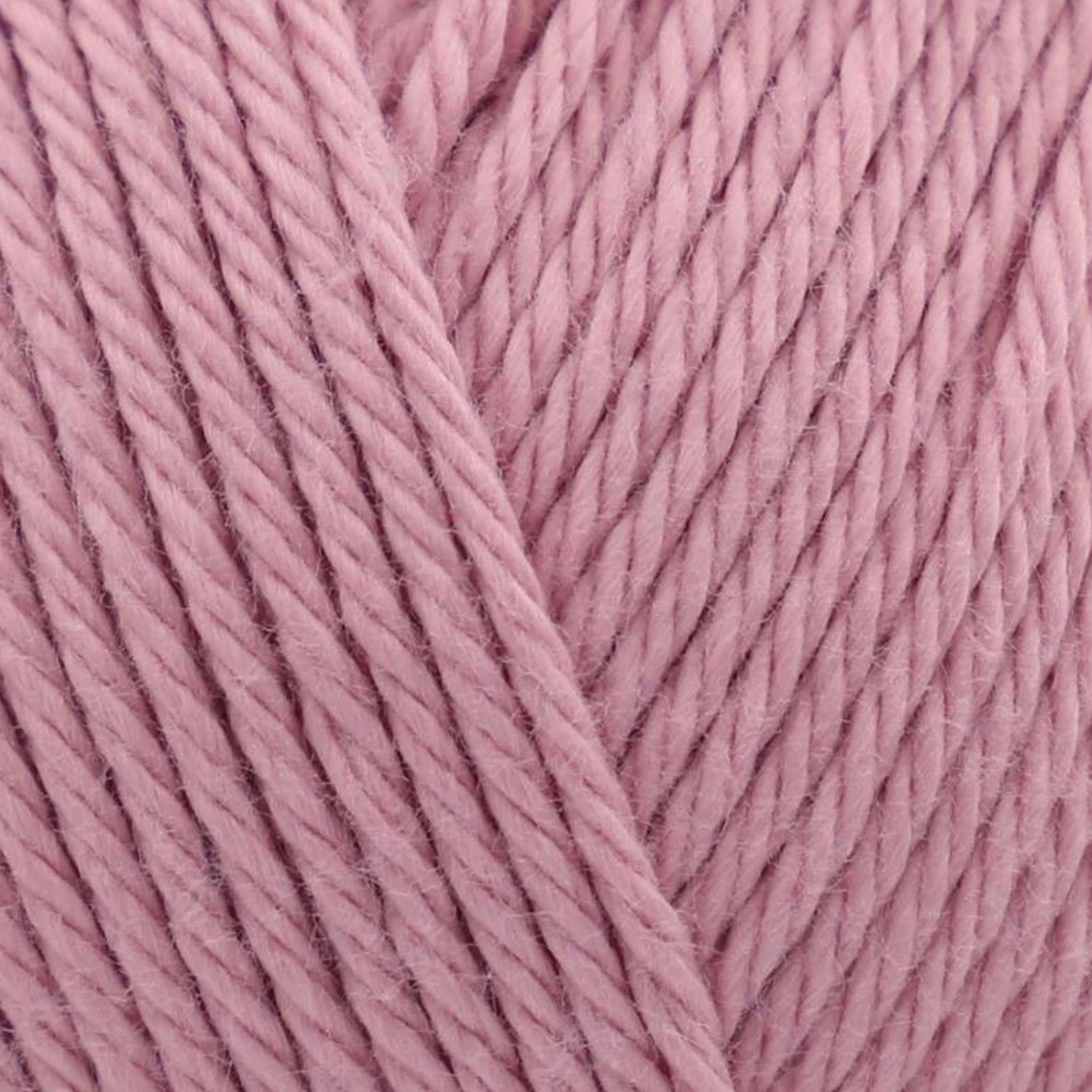 James C. Brett It’s Pure Cotton DK yarn Blush IC25, soft blush pink 100% cotton DK yarn texture close-up.