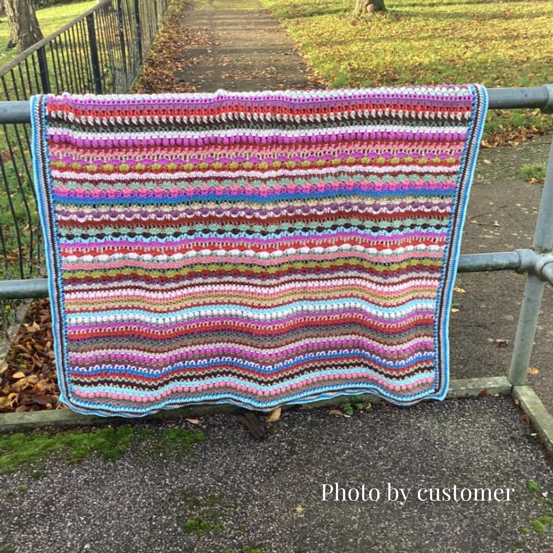 Windermere blanket hanging over the railing made by customer