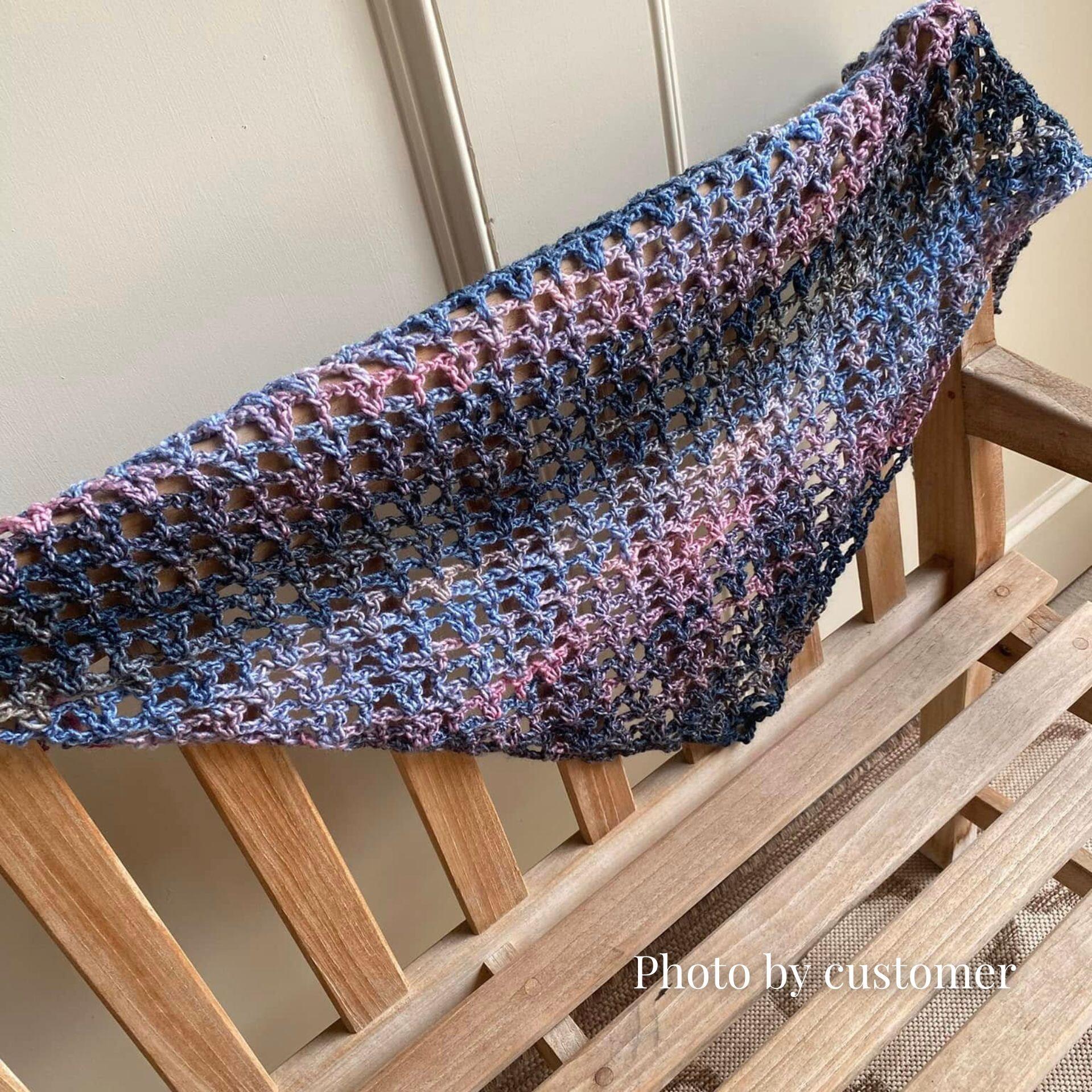 Shawl made in the colour way Love, EM04: a captivating blend of dusky blues, soft pinks, and deep charcoals