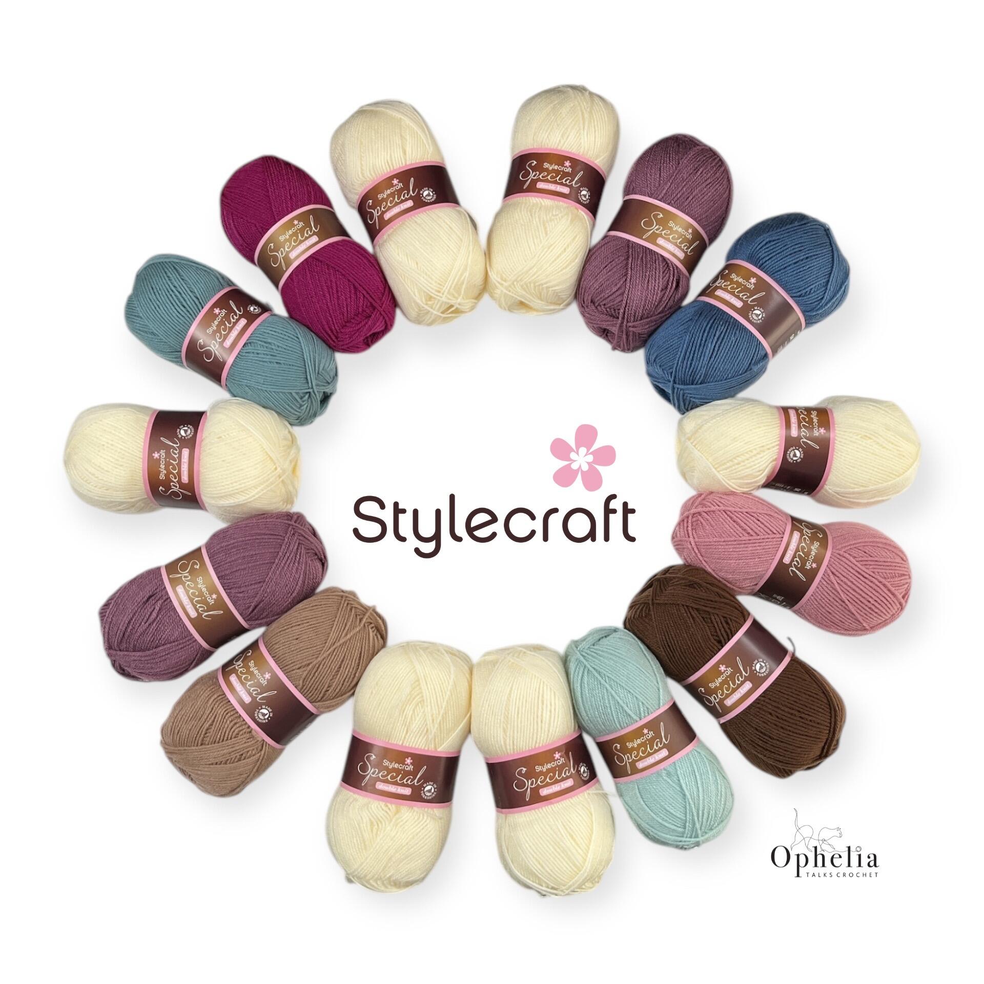 A yarn pack of 15 Stylecraft Special DK yarn balls artistically arranged in a circular pattern, showcasing inviting shades of cream, pink, teal, blue, and brown, thoughtfully curated for the Odyssey Crochet-Along by Ophelia Talks Crochet.