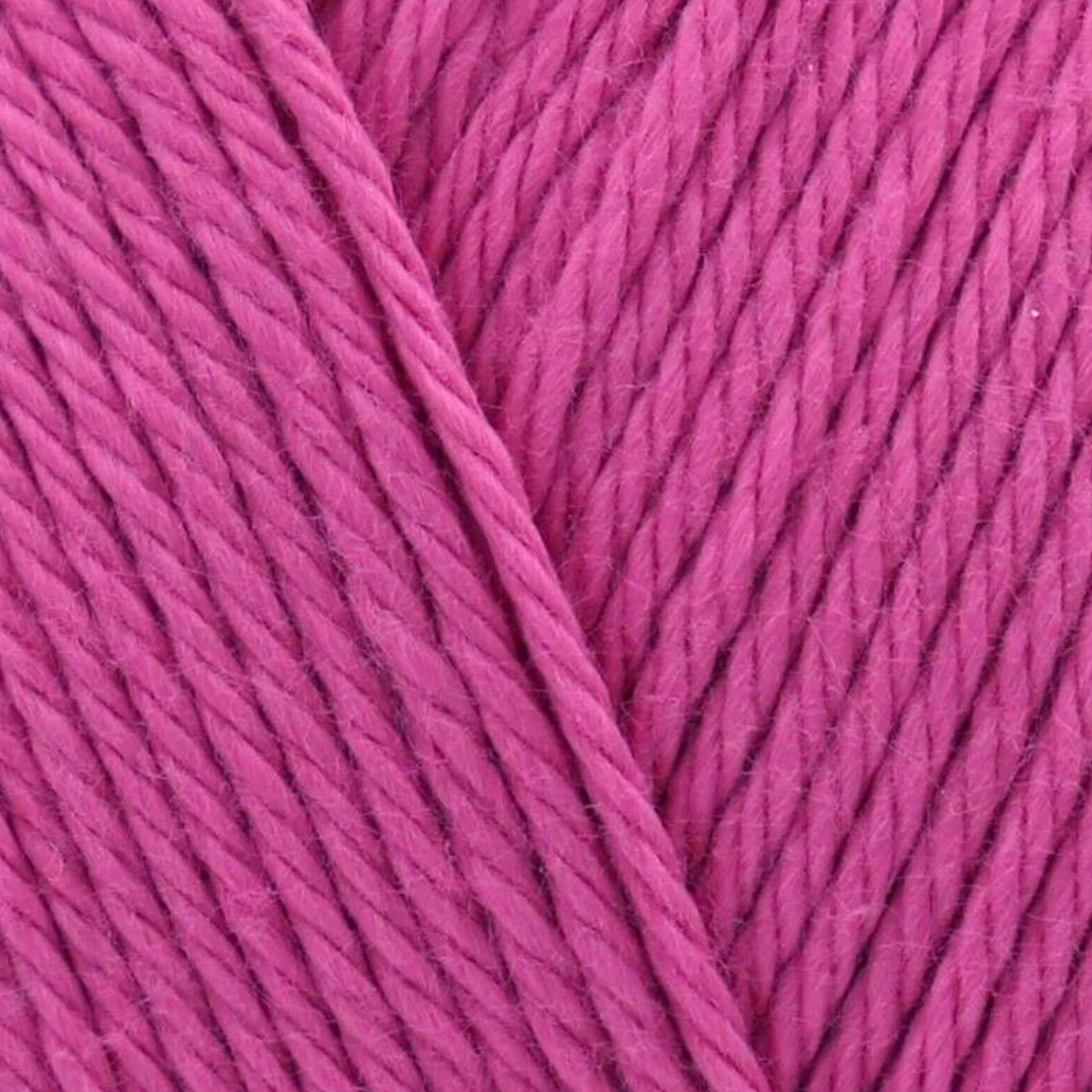 James C. Brett It’s Pure Cotton DK yarn Raspberry IC28, 100% cotton DK yarn texture in a vibrant raspberry pink shade.