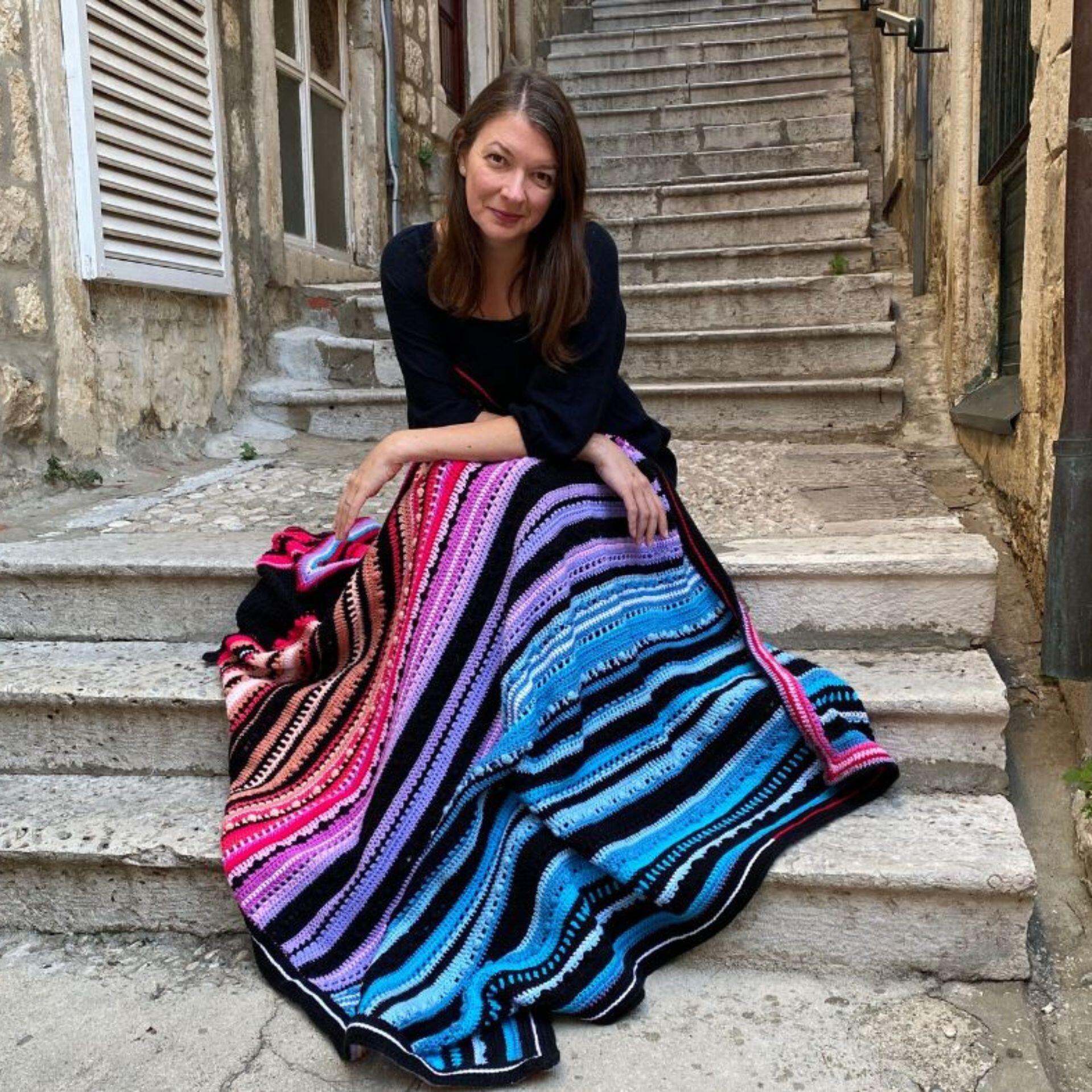 Anja showing the blanket sitting on the stairs