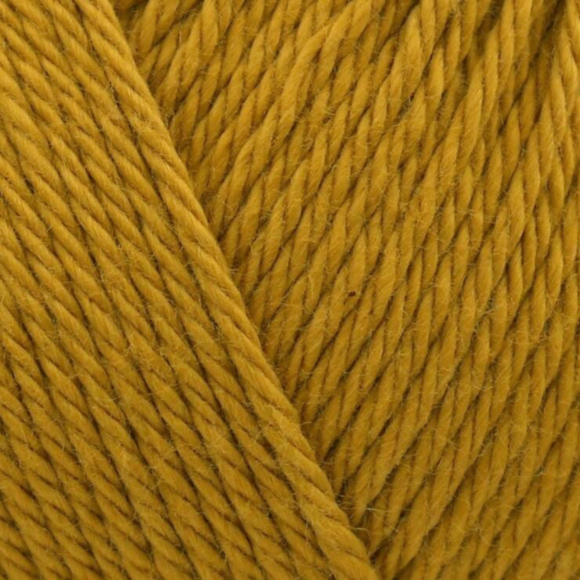James C. Brett It’s Pure Cotton DK yarn Mustard IC21, 100% cotton DK yarn texture in a rich golden mustard yellow shade.