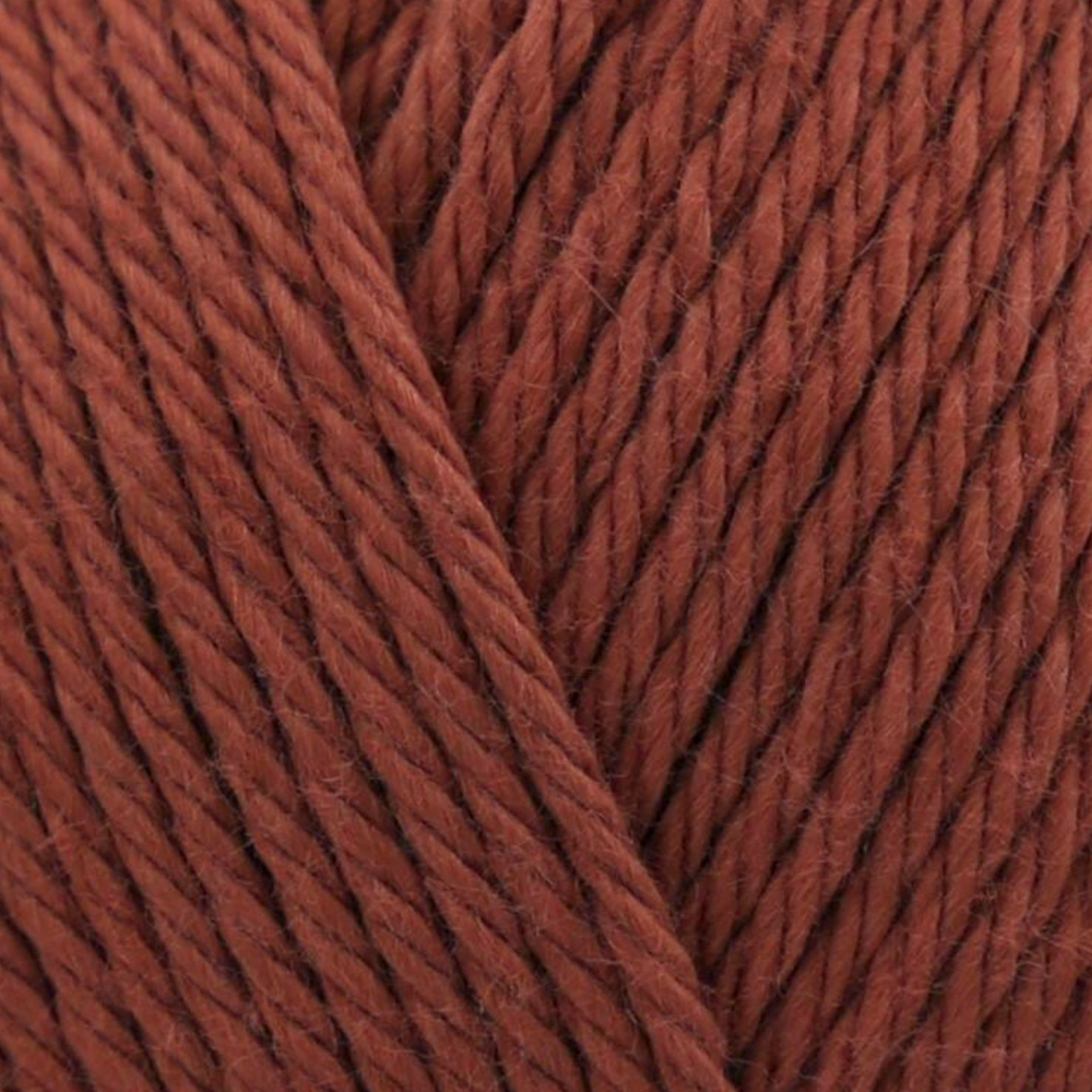 James C. Brett It’s Pure Cotton DK yarn Terracotta IC22, 100% cotton DK yarn texture in a rich earthy terracotta clay shade.