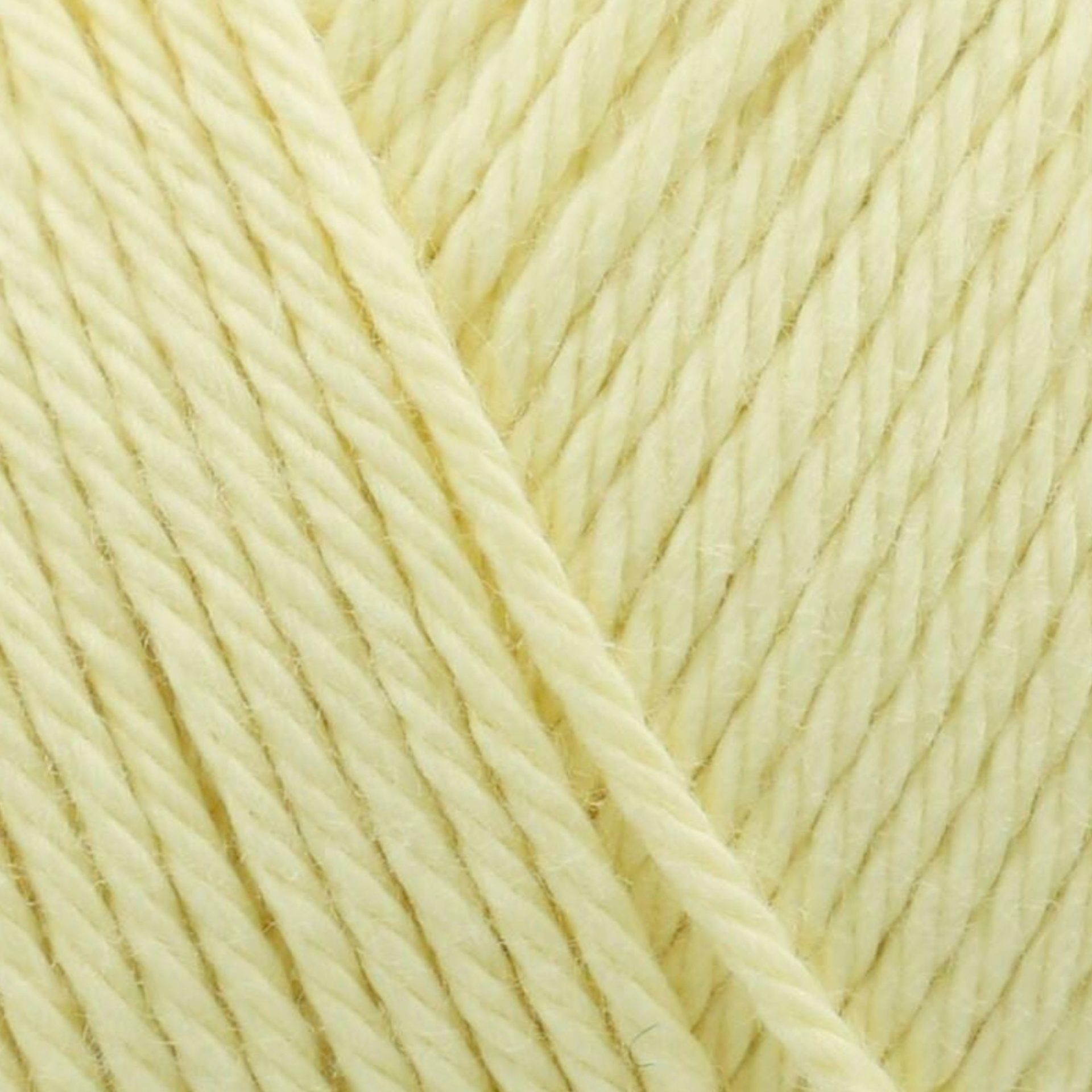 James C. Brett It’s Pure Cotton DK yarn Lemon IC02, 100% cotton DK yarn texture in a soft pastel yellow shade.