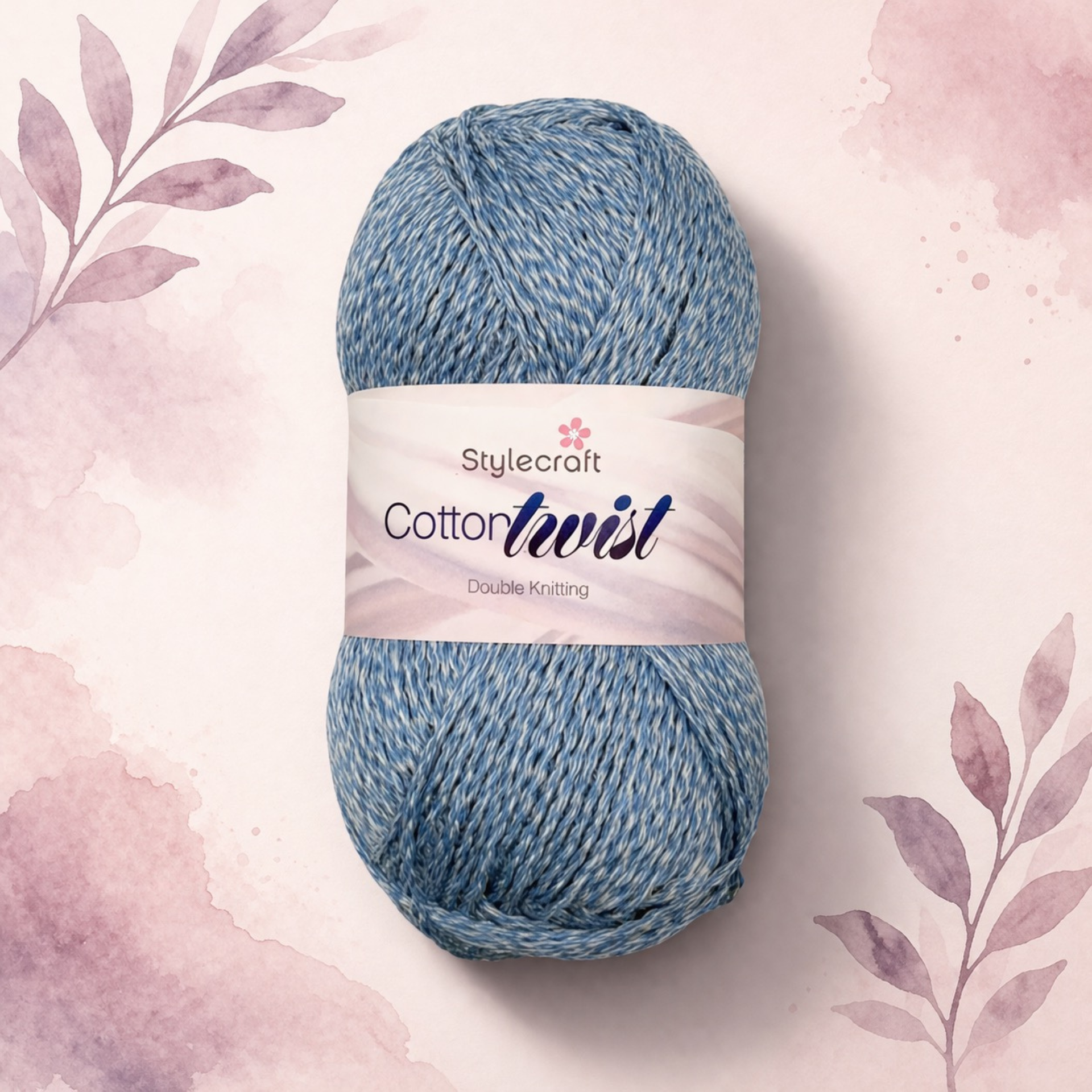 Stylecraft Cotton Twist Double Knitting yarn in blue mix, soft cotton blend yarn for crochet and knitting, shown on pastel floral background with shadow.
