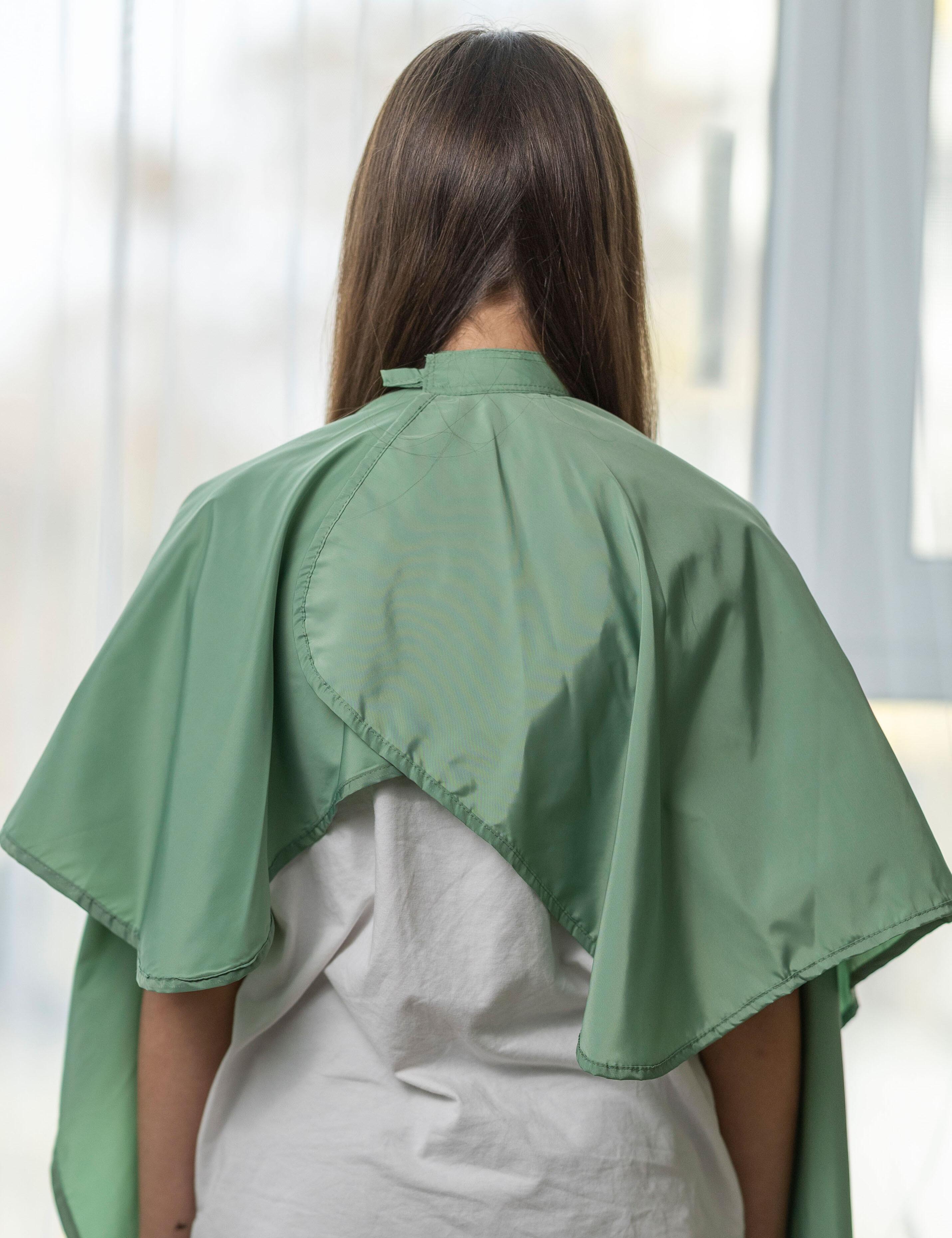 Children’s salon cape in Olive for haircuts