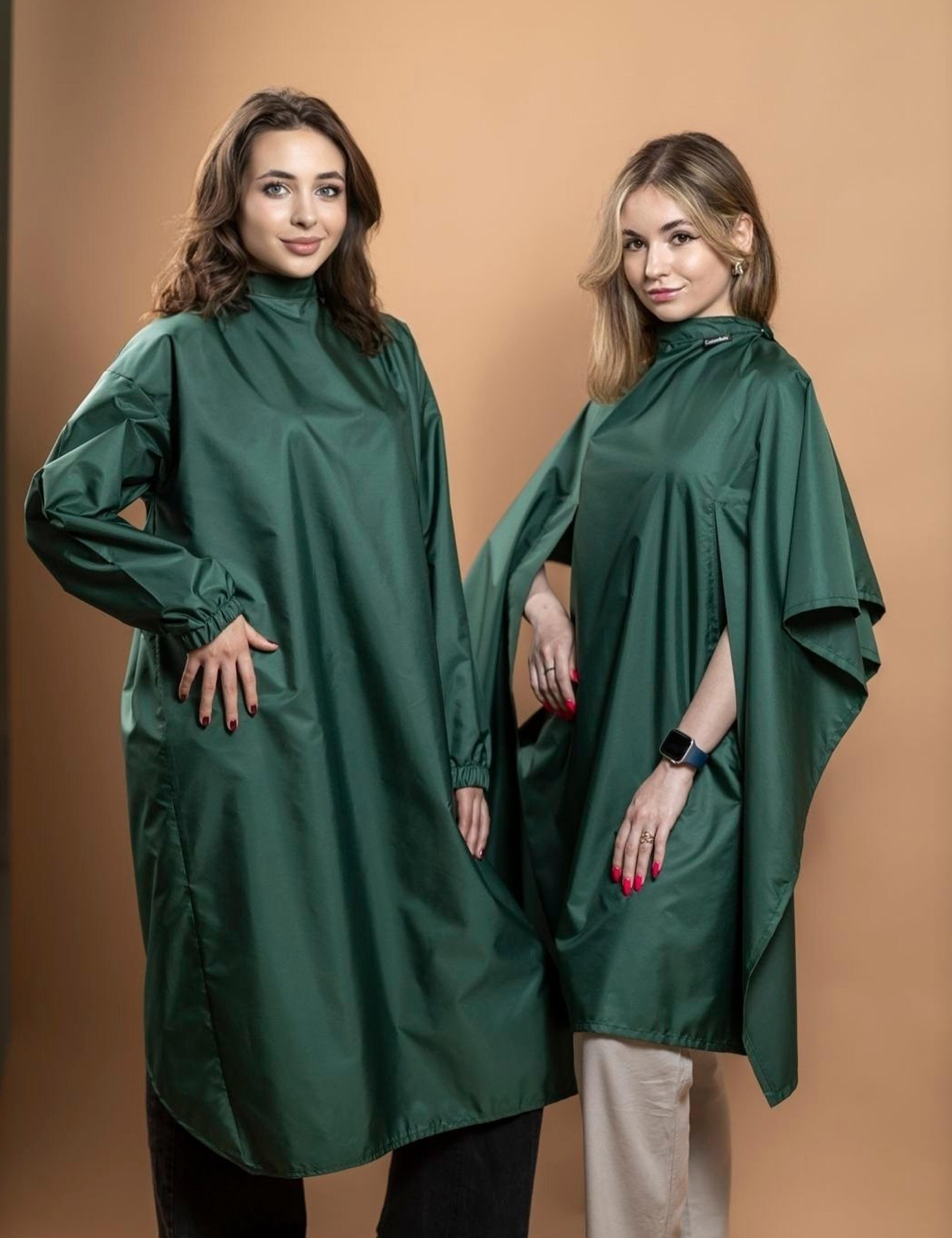 Set of matching bottle green salon capes and gowns in various styles