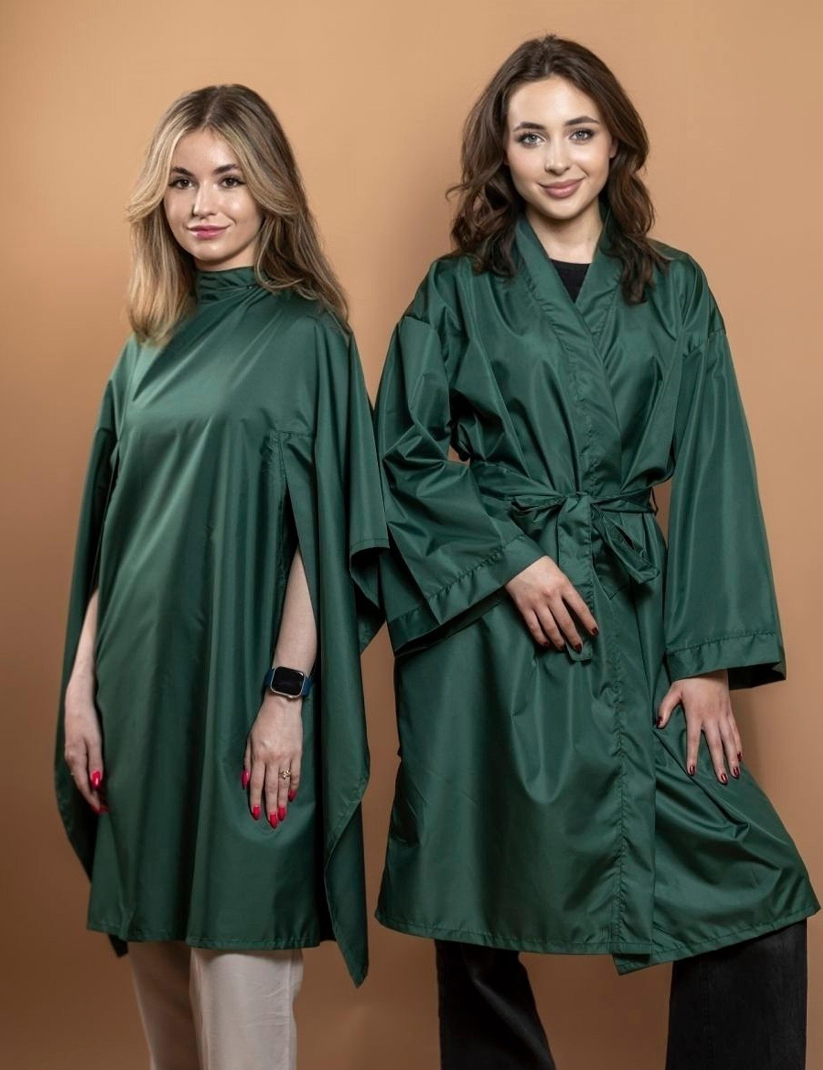 Multi-pack of professional emerald green hairdressing gowns and cutting capes.