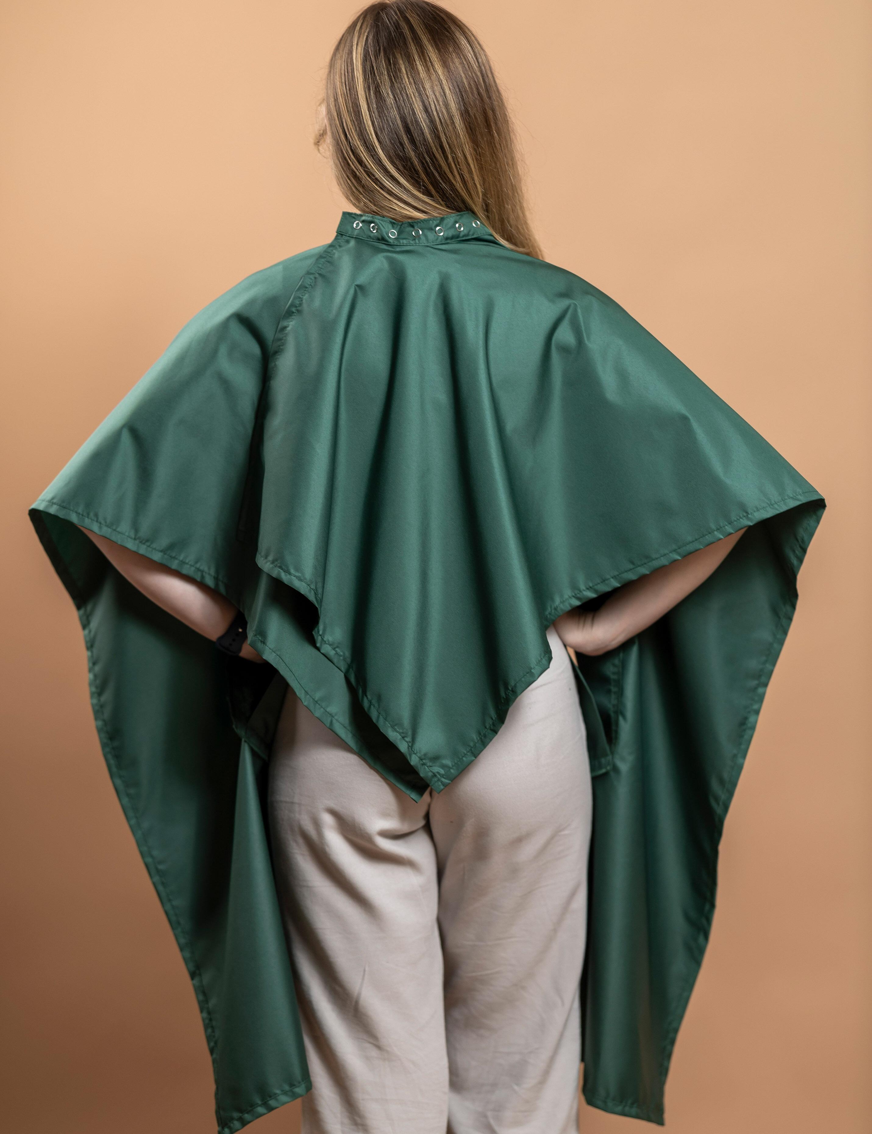 Waterproof bottle green hairdressing gown with arm slits.