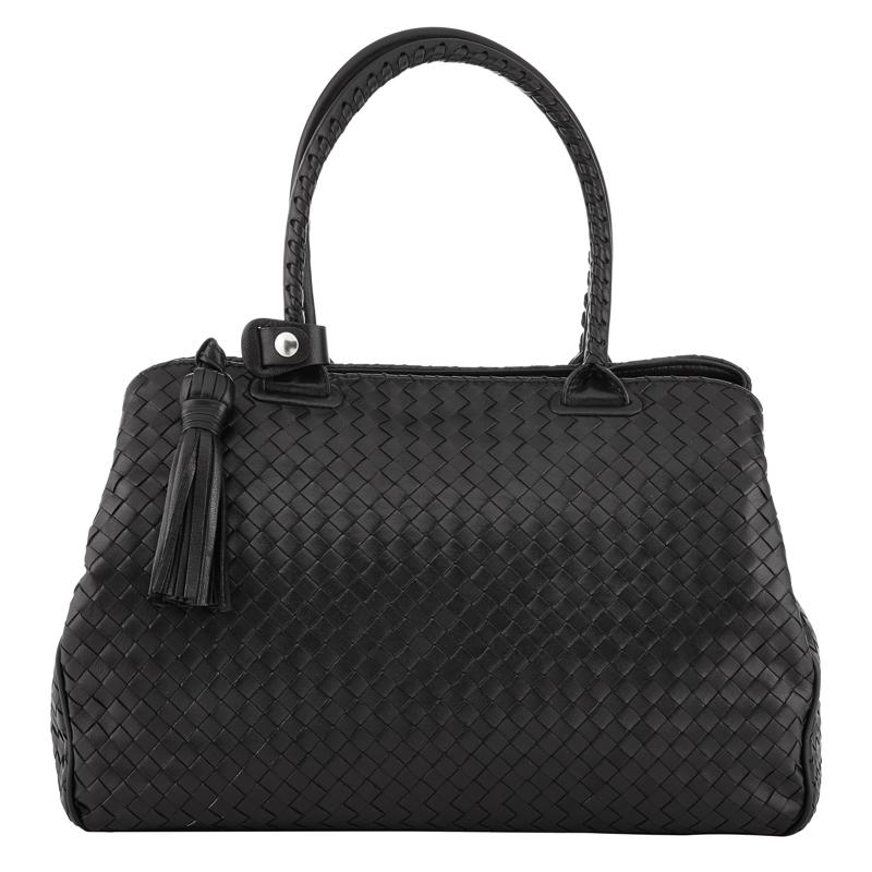 Exquisite woven leather handbag in black with double handle and pull tassel.