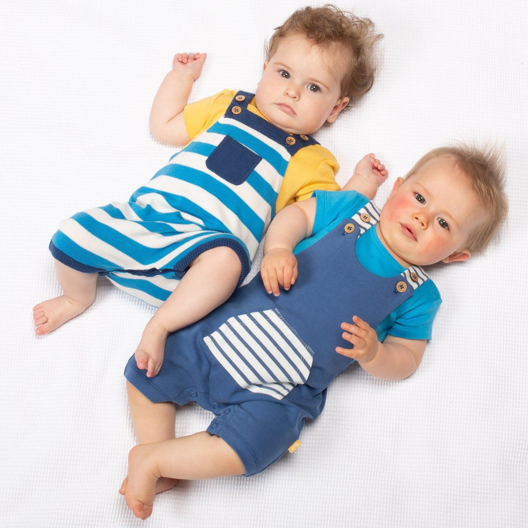Baby wearing Kite Clothing Stripy Knit Dungarees with friend