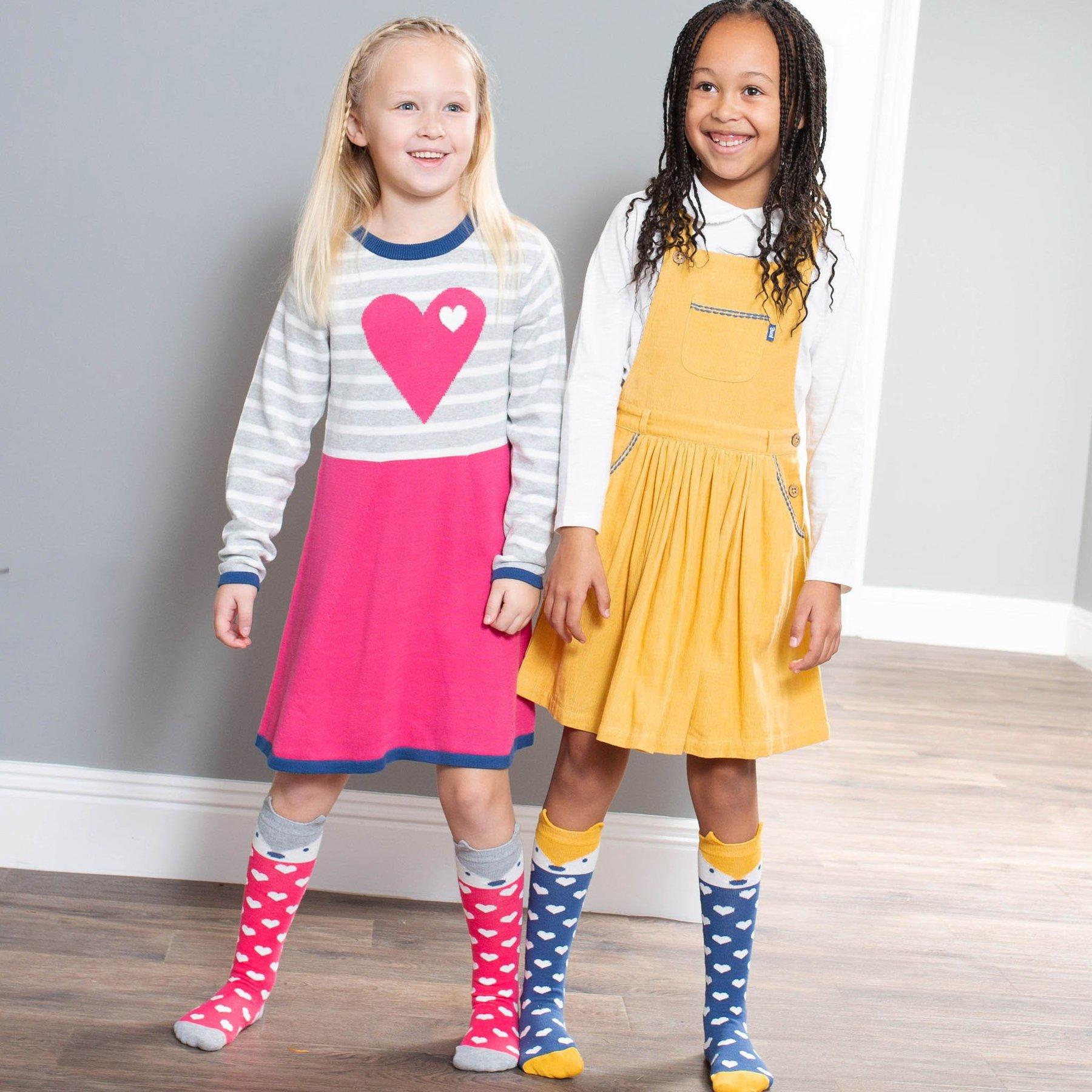 Girl wearing Kite Clothing Twirly Pinafore with friend