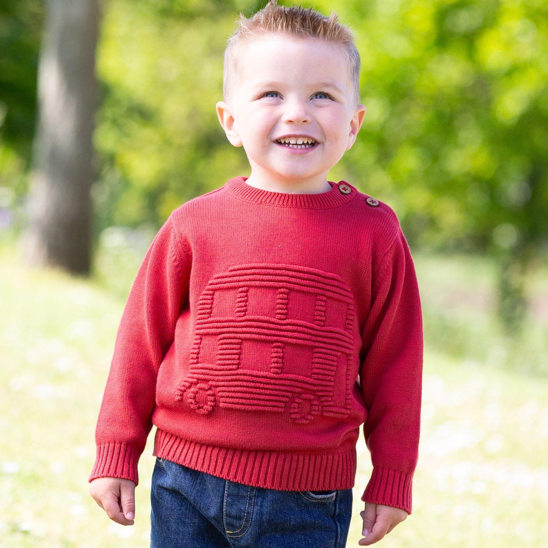Boy wearing Kite Clothing big red bus jumper