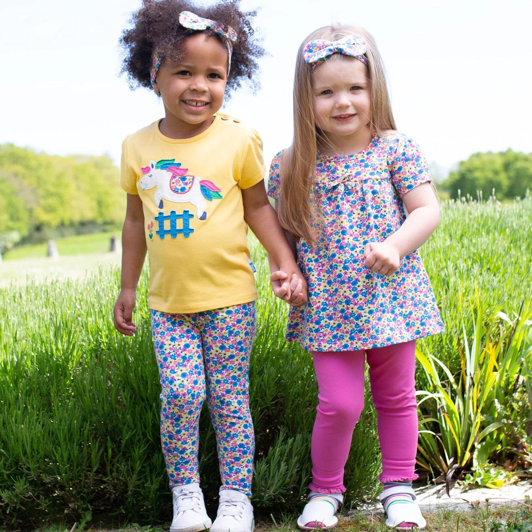 Girl wearing Kite Clothing bee ditsy tunic with friend